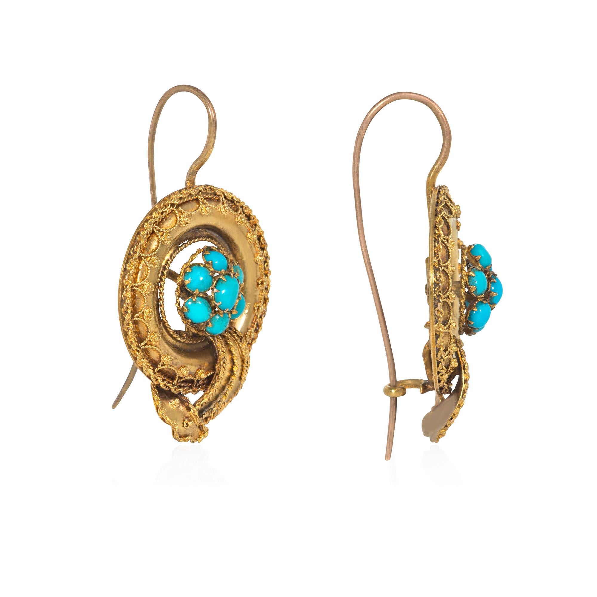 A pair of antique gold earrings designed as pavé turquoise bullas in gold frames with applied granulation and wirework and draped sashes, in 14k.  Approximately 1.5 inches long, including top of wire