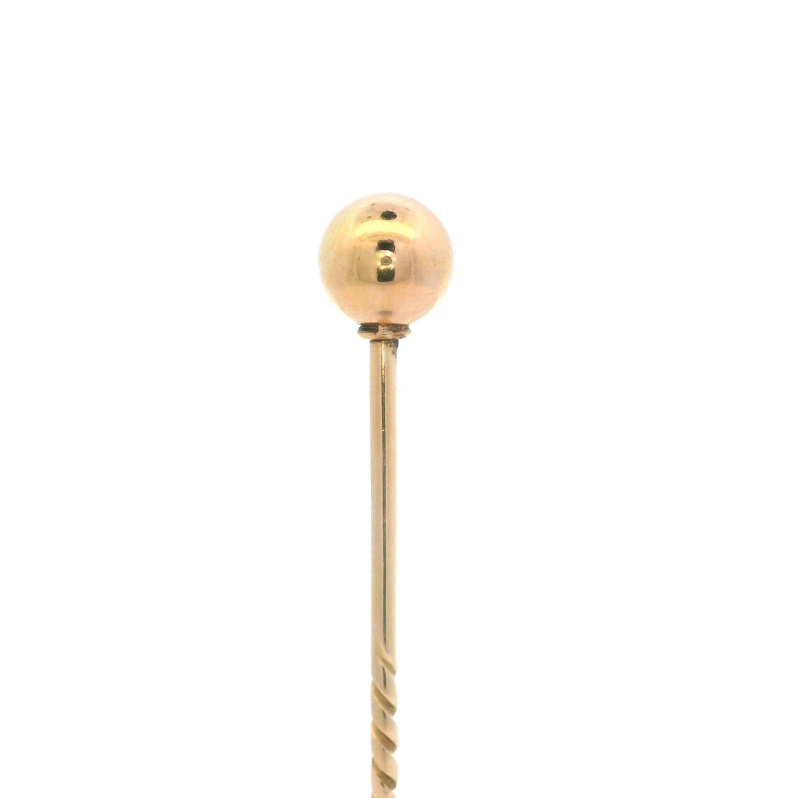 A Victorian gold ball 15 karat yellow gold stick pin

This charming stick pin features a plain polished gold ball set to its centre mounted onto a 15 karat yellow gold stick pin, with ridged detail to the length of the pin, to enable a secure grip