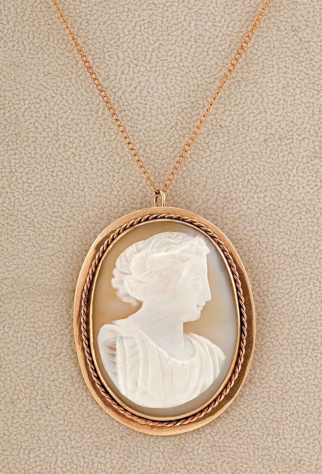 Stunning 19th Century Antique Shell Cameo in Yellow Gold that can be worn both as a pendant or brooch.  The beautiful gold frame highlights this intricately carved goddess.  The brooch was tested as 14K.  I purchased this with no chain but adding a