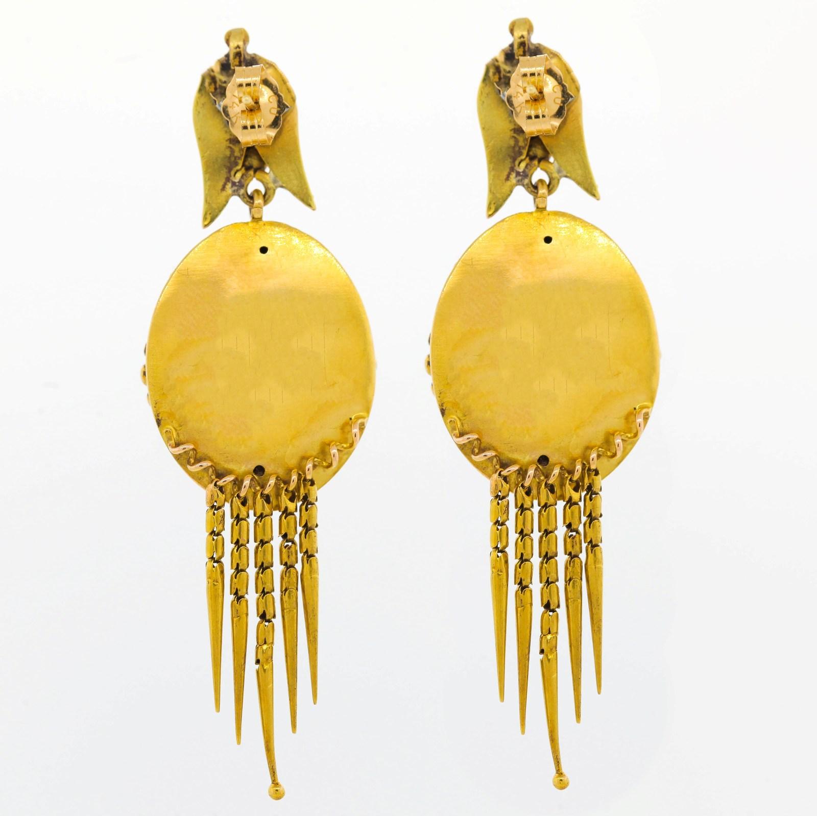 Circa 1890s oval shape earrings created in 14KT yellow gold and suspended from a finial.  They are dramatically adorned with five dangling tassels delicately ornamented. Understated but certain to be noticed!