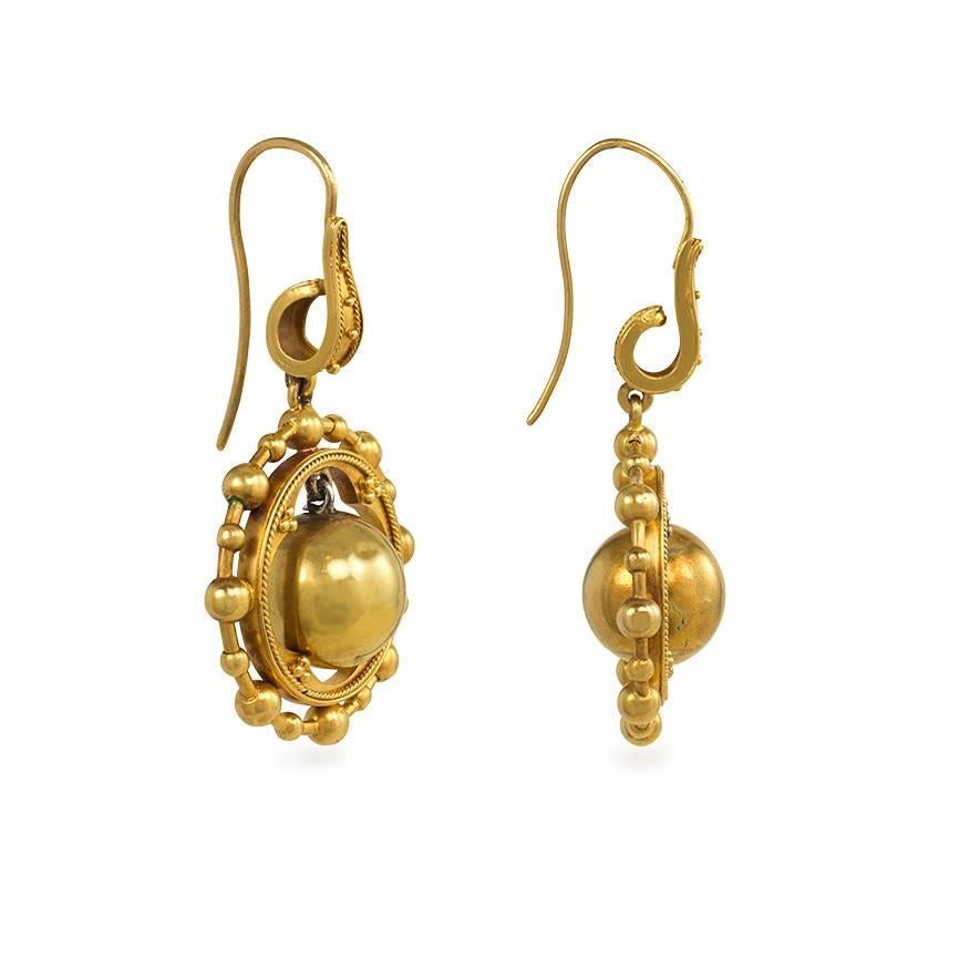 A pair of antique gold bead pendant earrings with beaded surrounds and applied granulation, in 15k.  England