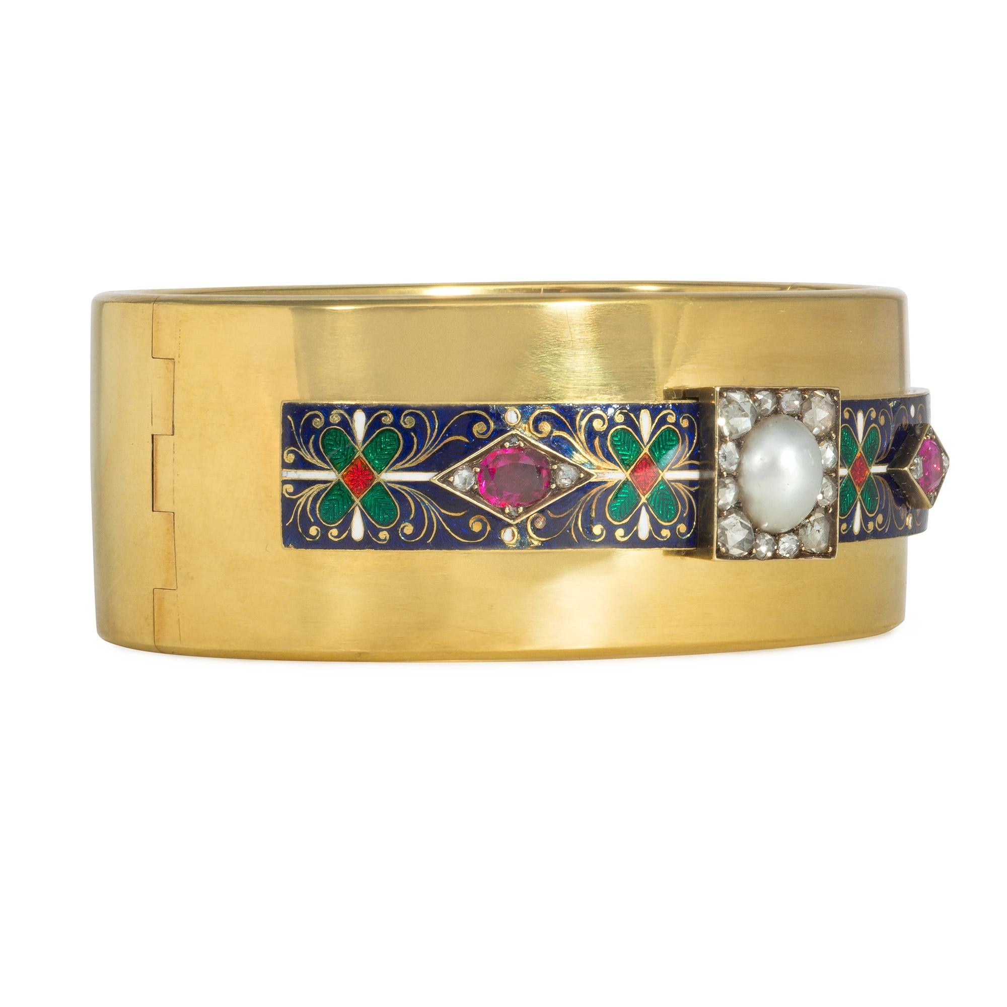 An antique ruby, diamond, pearl, and enamel Holbeinesque cuff bracelet centered by a pearl in a rose-cut diamond surround and flanked by rectangular enameled elements, each centered by rubies and diamonds set in a rhombus, in 15k gold. 