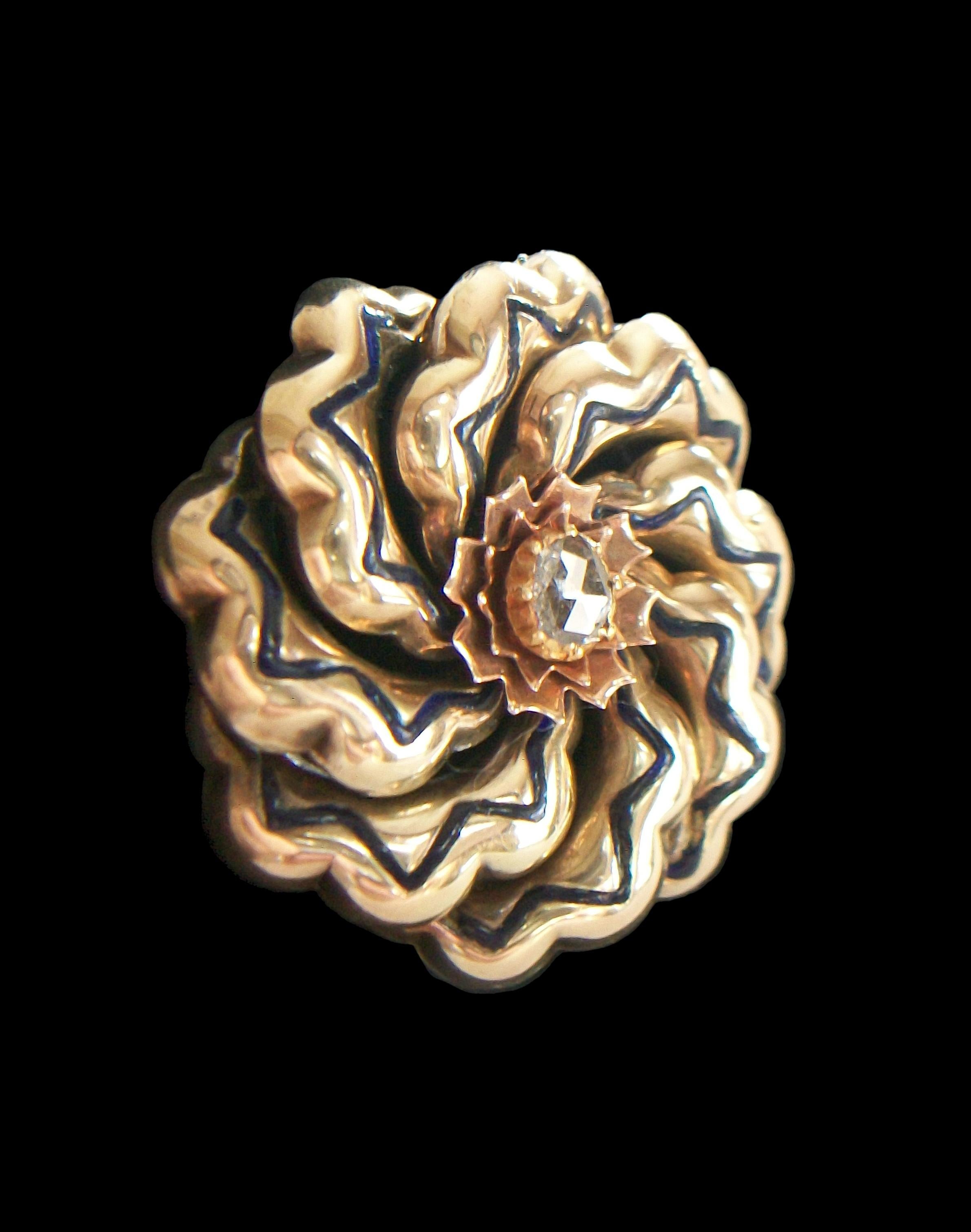 Antique Victorian 14K yellow and rose gold with enamel, stylized floral infinity brooch - clawed collet set rose cut diamond to the center (6 mm. x 5 mm. - approximate) surrounded by rose gold 'petals' - eight spiraling arms with inset zigzag black