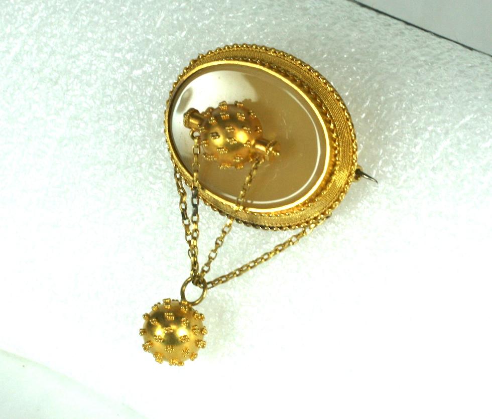 Victorian 14k Gold Etruscan Agate Brooch from the mid 19th Century. Lovely 14k gold work throughout with Etruscan bead work on the ball motifs. 
Intricate wire work forms the bezel around the focal agate oval into which an Etruscan ball motif is