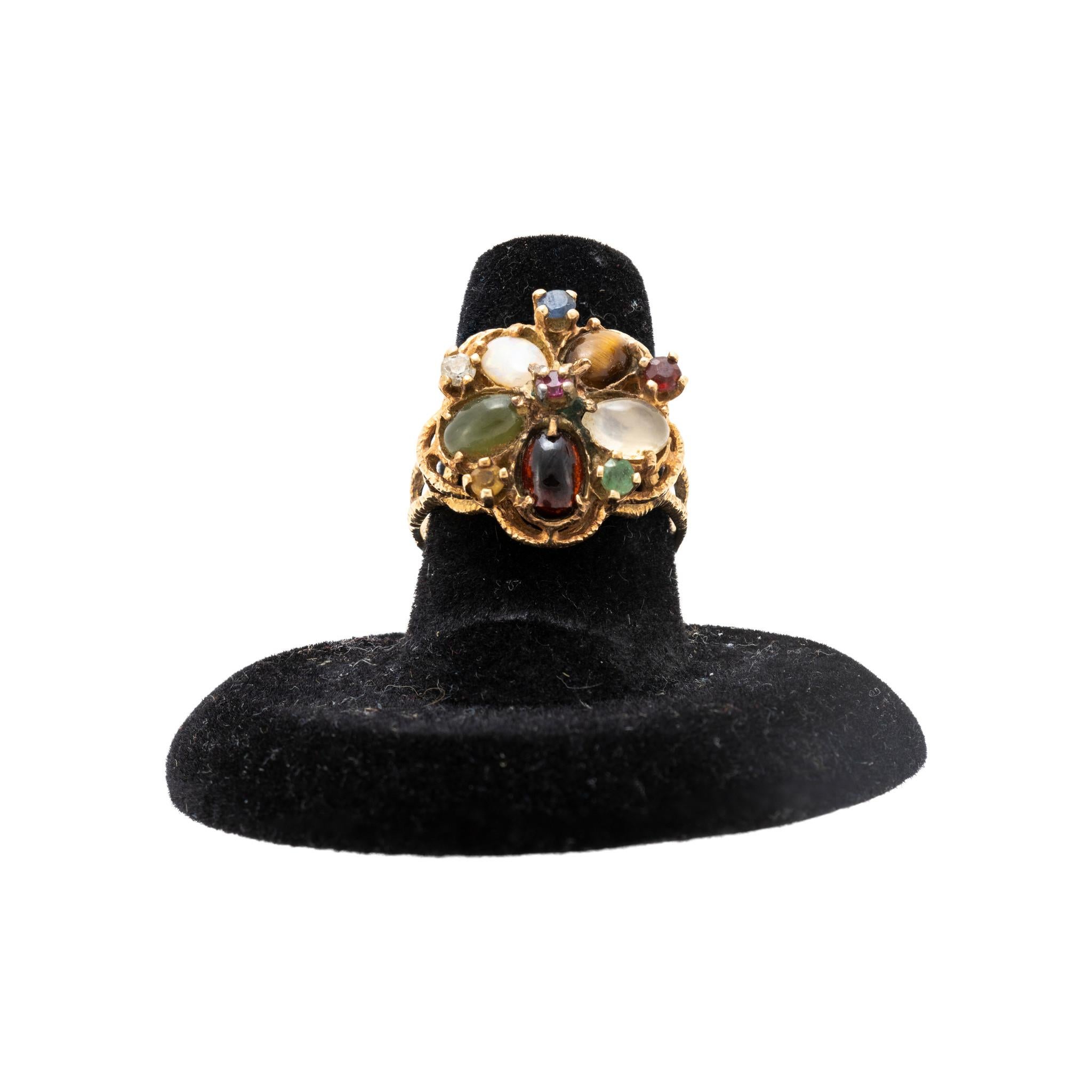 Victorian filigree in 14kt yellow gold with natural garnet, ruby, sapphire, emerald, moonstone, diamond, citrine and tiger eye. Intricate detail in gold with smooth band, featuring an almost stippled texture. Larger stones are oval cut and arranged