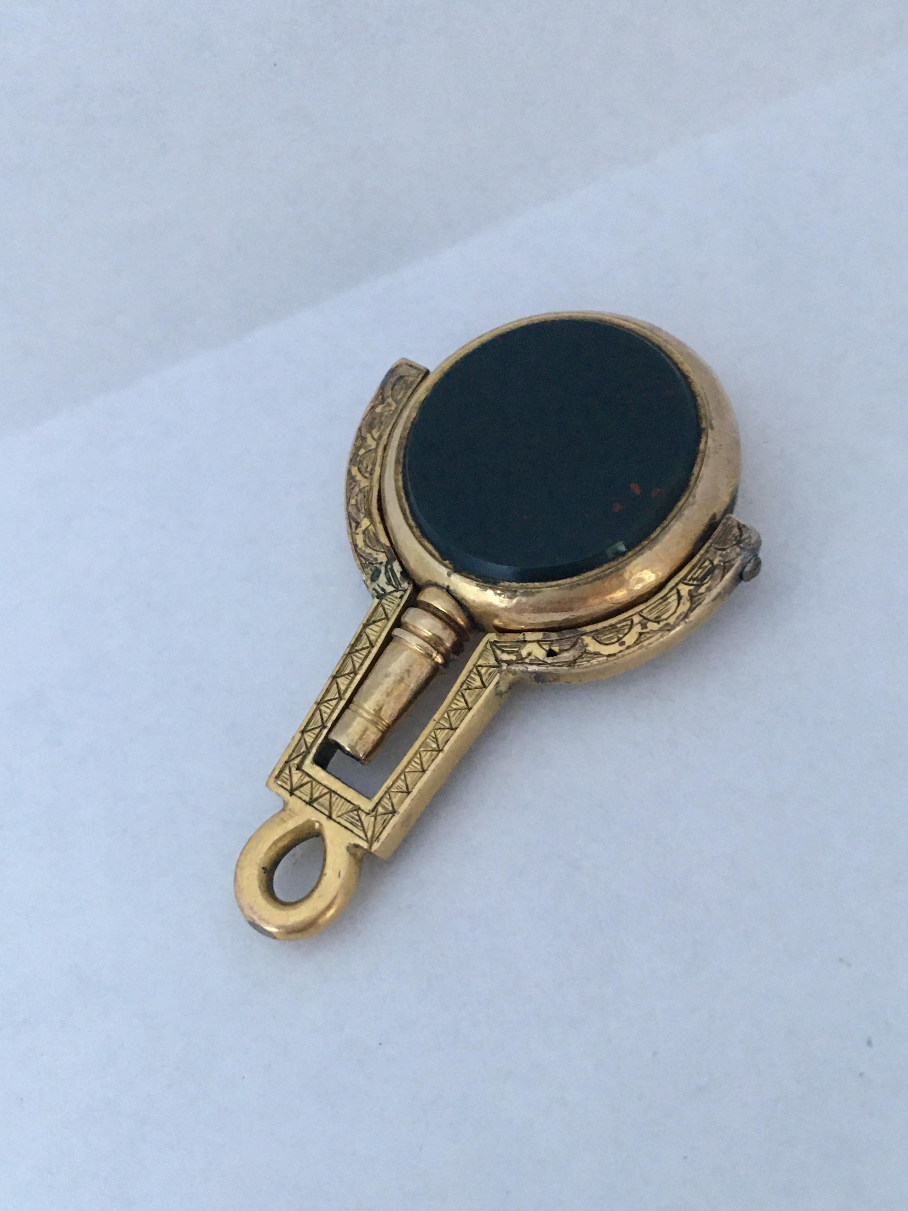 This stunning stone set swivel fob with watch key. For watch chain or pendant. Set with a polished bloodstone on one side and a sardonyx on the other side. It measured 40mm long as a pendant or 50mm long as a watch key and 26mm wide and weigh 8.3