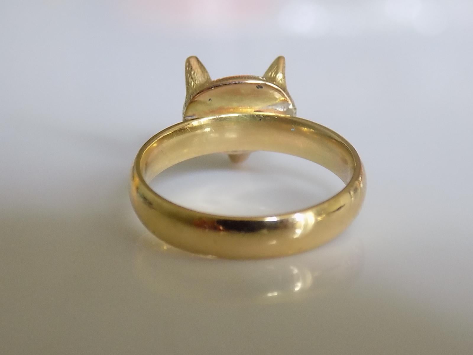 An Extremely Rare, Fine Quality Victorian c.1890 15 Carat Gold Fox Head ring on later 18 Carat Gold shank. The head with one Ruby eye and realistic made another eye. The red eye indicates the accuracy of the shooting hunter that the fox was killed