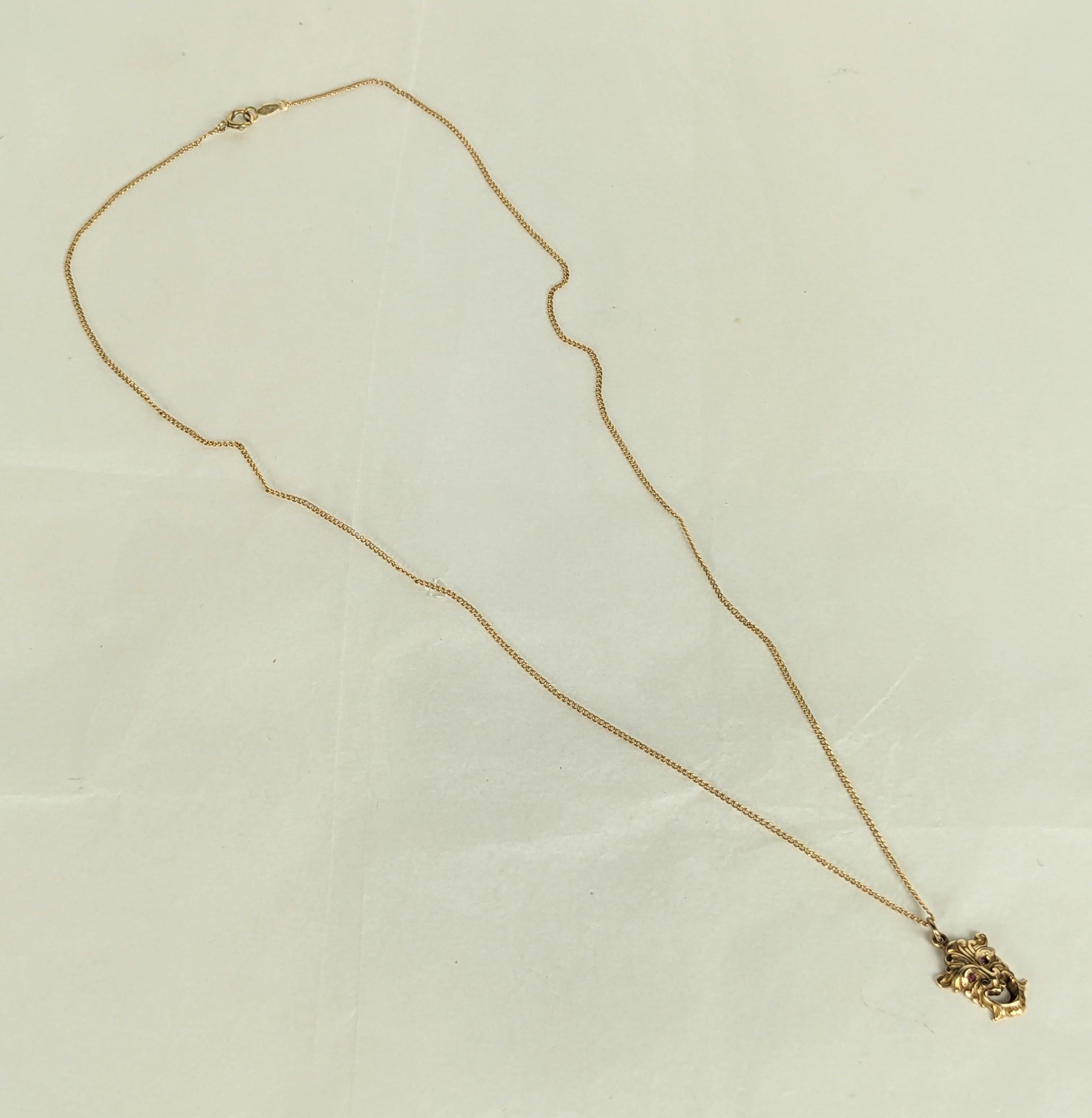 Charming Victorian Gold Gargoyle Pendant in 14k gold. Beautiful detailing with tiny ruby eyes. 1870's USA. 
18