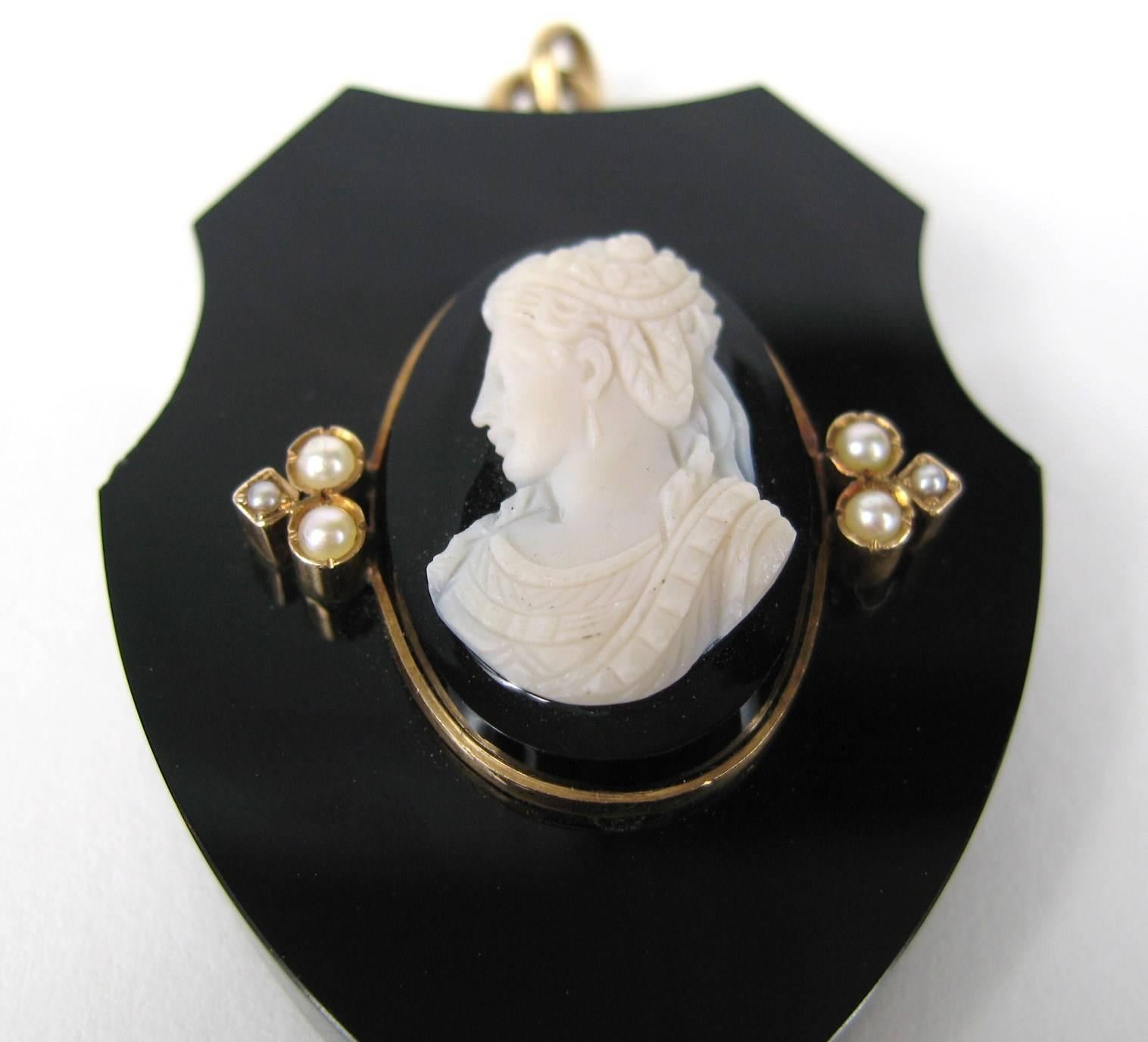 Black jet Victorian 14k Gold locket with Gold detailing. Seed Pearl accents. Finely detailed Cameo. Measuring 2.00 in x 1.40 in. This is out of a massive collection of Hopi, Zuni, Navajo, Southwestern, sterling silver, costume jewelry and fine
