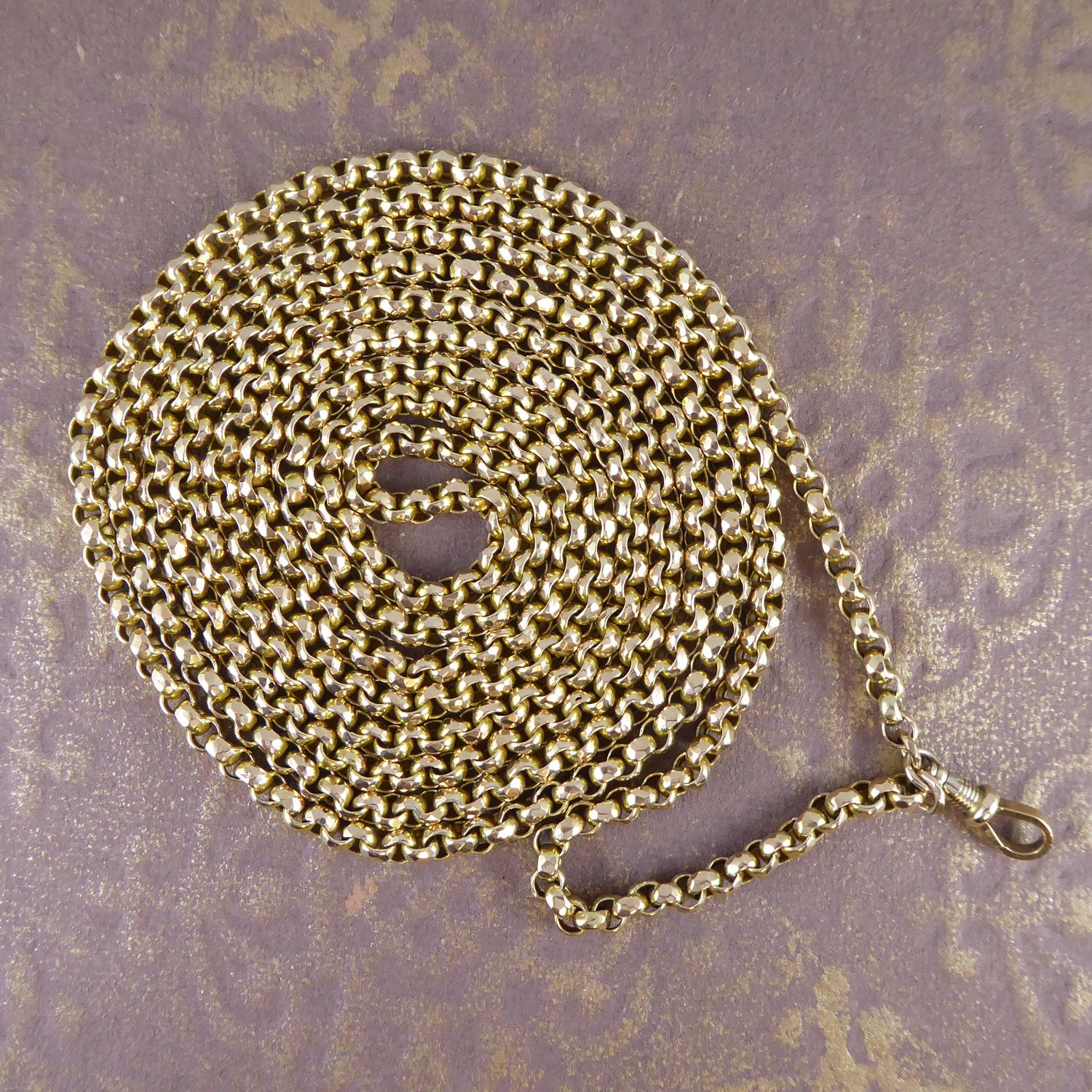 A Victorian yellow gold muff chain of substantail weight and size.  The chain measures approx. 61 inches long plus the swivel clip catch which measures 0.75