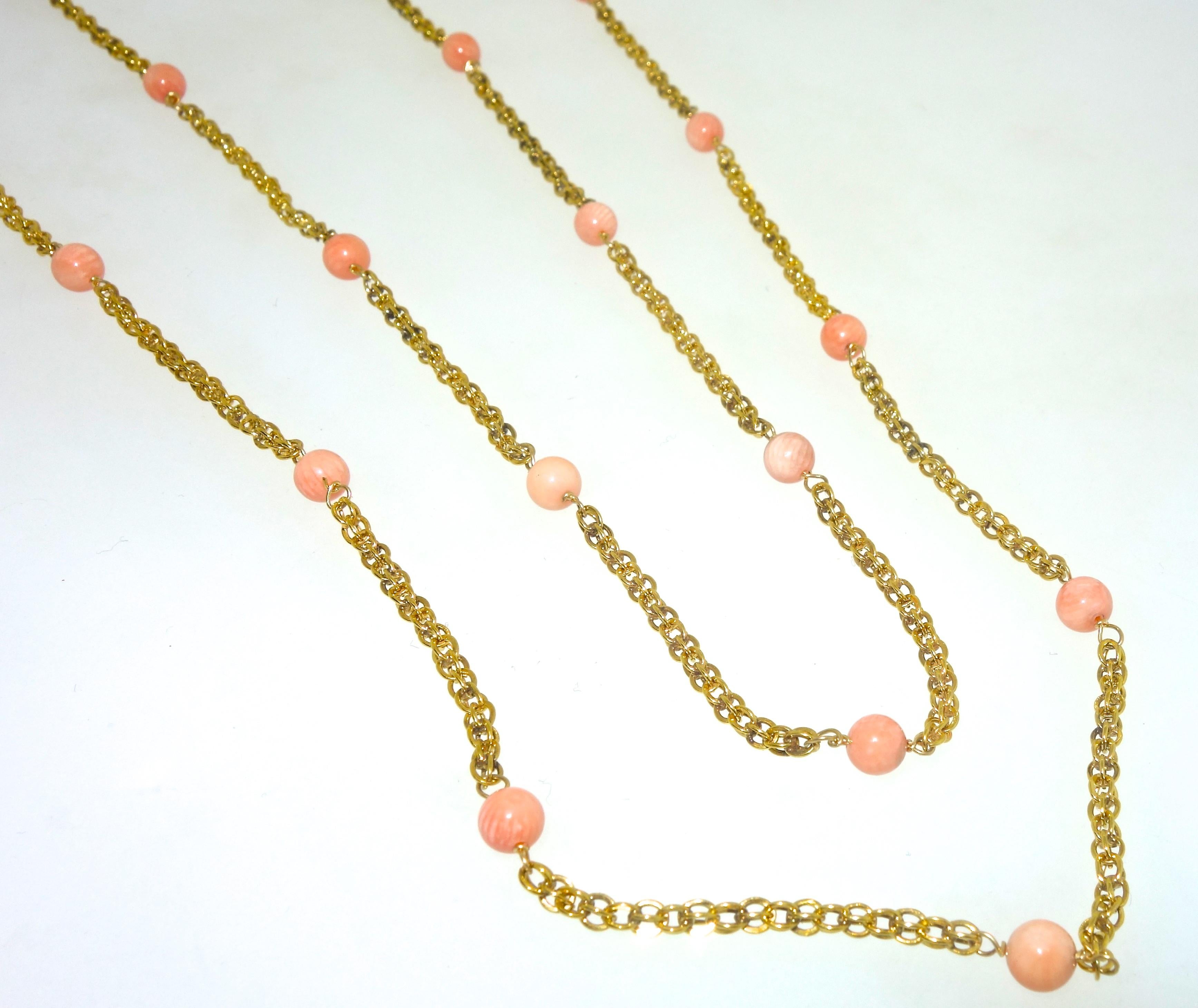 Late 19th Century long gold chain with 31 natural coral beads, the necklace is 61 inches long and can be worn a variety of lengths.  The piece weighs 34.22 grams and is in fine condition, circa 1890