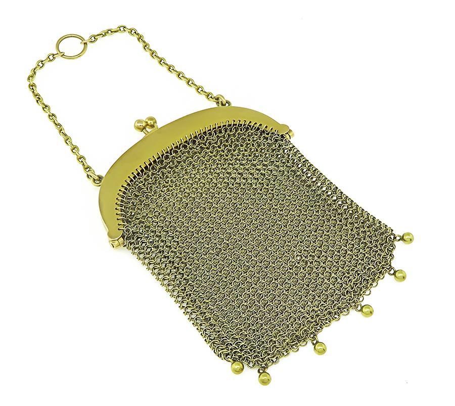This is an amazing 14k yellow gold mesh purse from the Victorian era. The purse measures 95mm by 66mm and weighs 42.5 grams. The purse is stamped 14K.