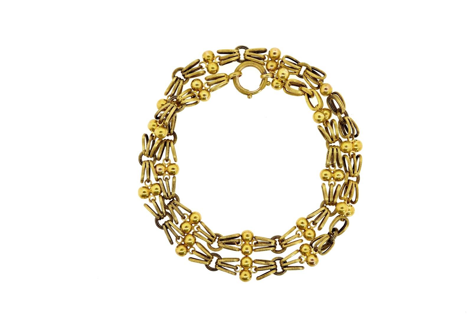 Created in the 1890's, this 14KT yellow gold Victorian necklace is an unusual beauty.  Articulated links of double balls and triple fluted loops make this easy to wear bauble one for the ages.  This unique necklace/chain could be the awaited