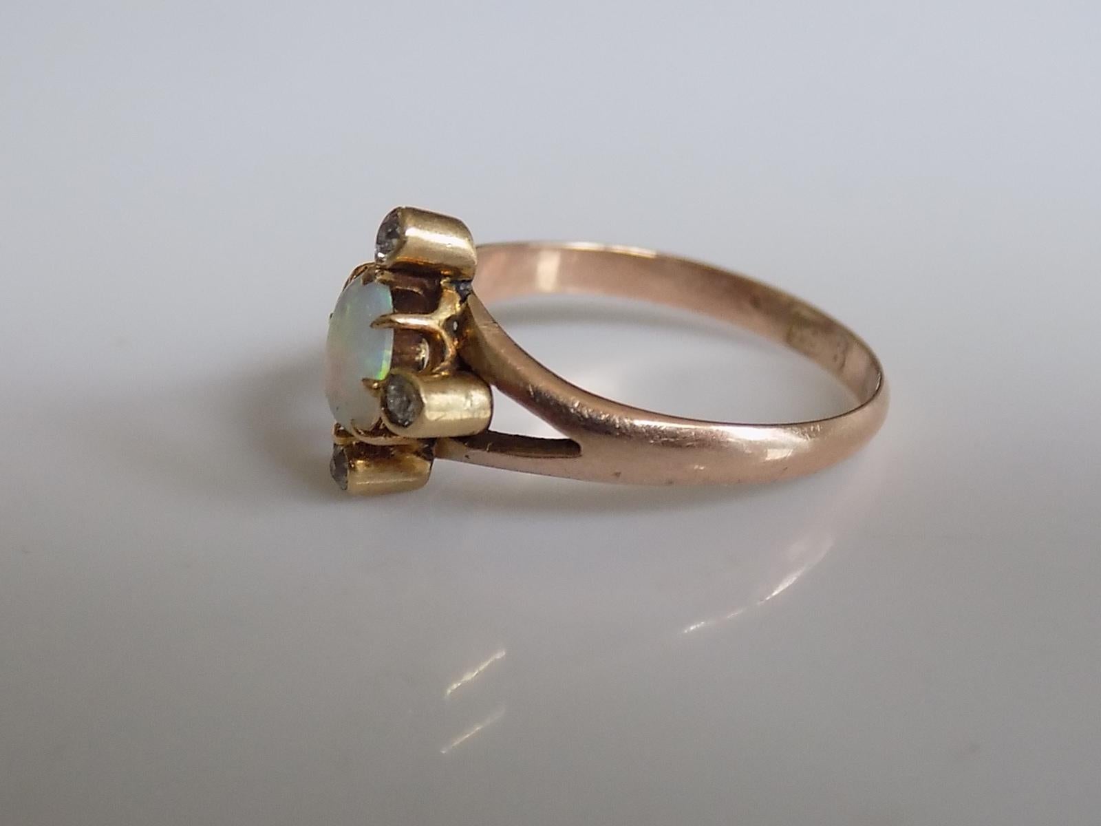 A Lovely Victorian 9 Carat Rose Gold, old cut Diamond and Opal ring. English origin.

Size L UK, 6 US.

Height of the face 12mm.
Weight 1.8gr.
The shank marked 9CT for 9 Carat Gold.

The ring in very good condition and ready to wear.