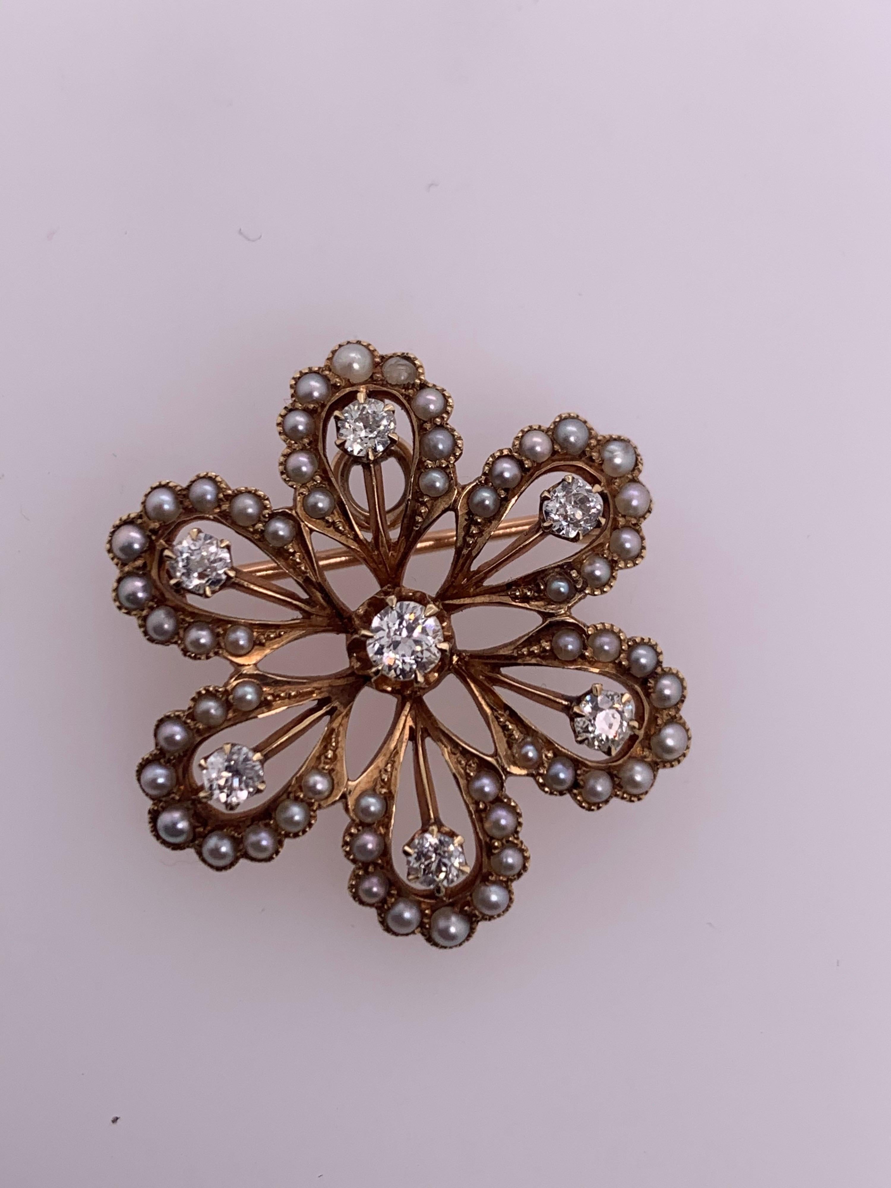 Victorian 14k Gold Pendant & Brooche, 0.65 Carat Natural Old European Diamond & Pearl Pin. The piece is set with 7 old euro diamonds, approximately F-G in color and VS-SI in clarity, ranging from 2.7-3.5mm. 

It is set with 54 pearls and weighs 6