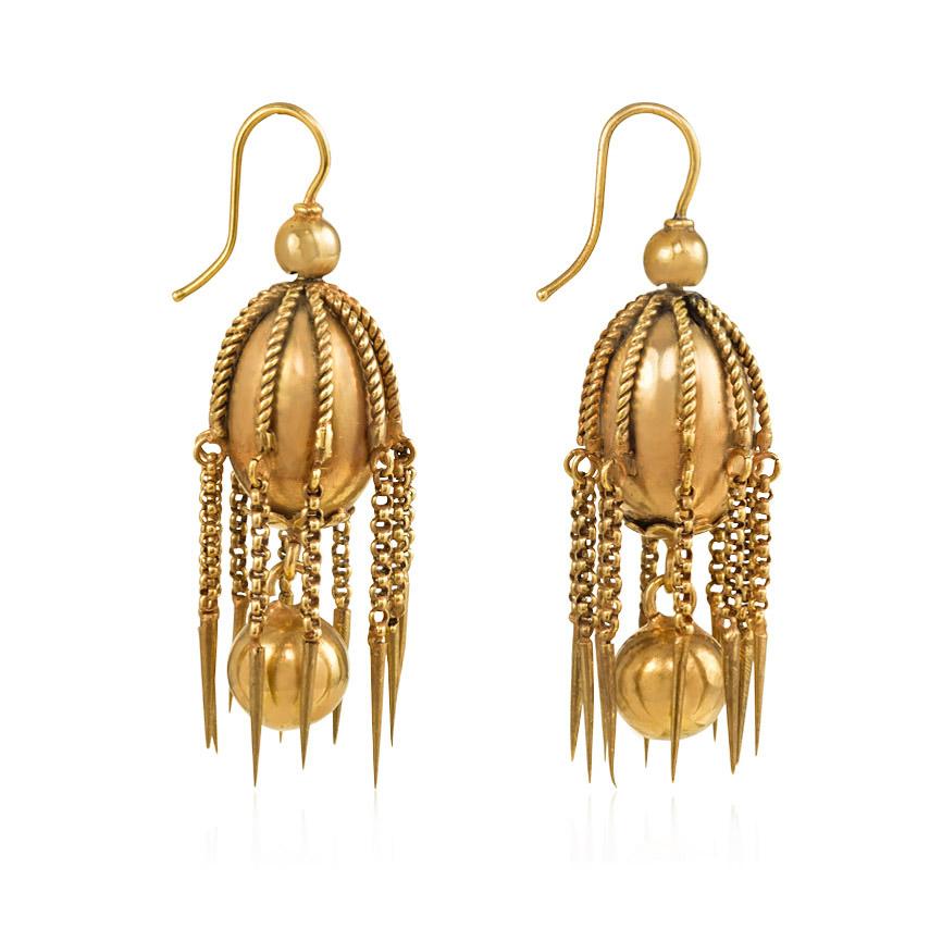 A pair of antique gold earrings comprised of gold oblong beads with applied wirework, chain fringe and bead pendants, in 15k.  England