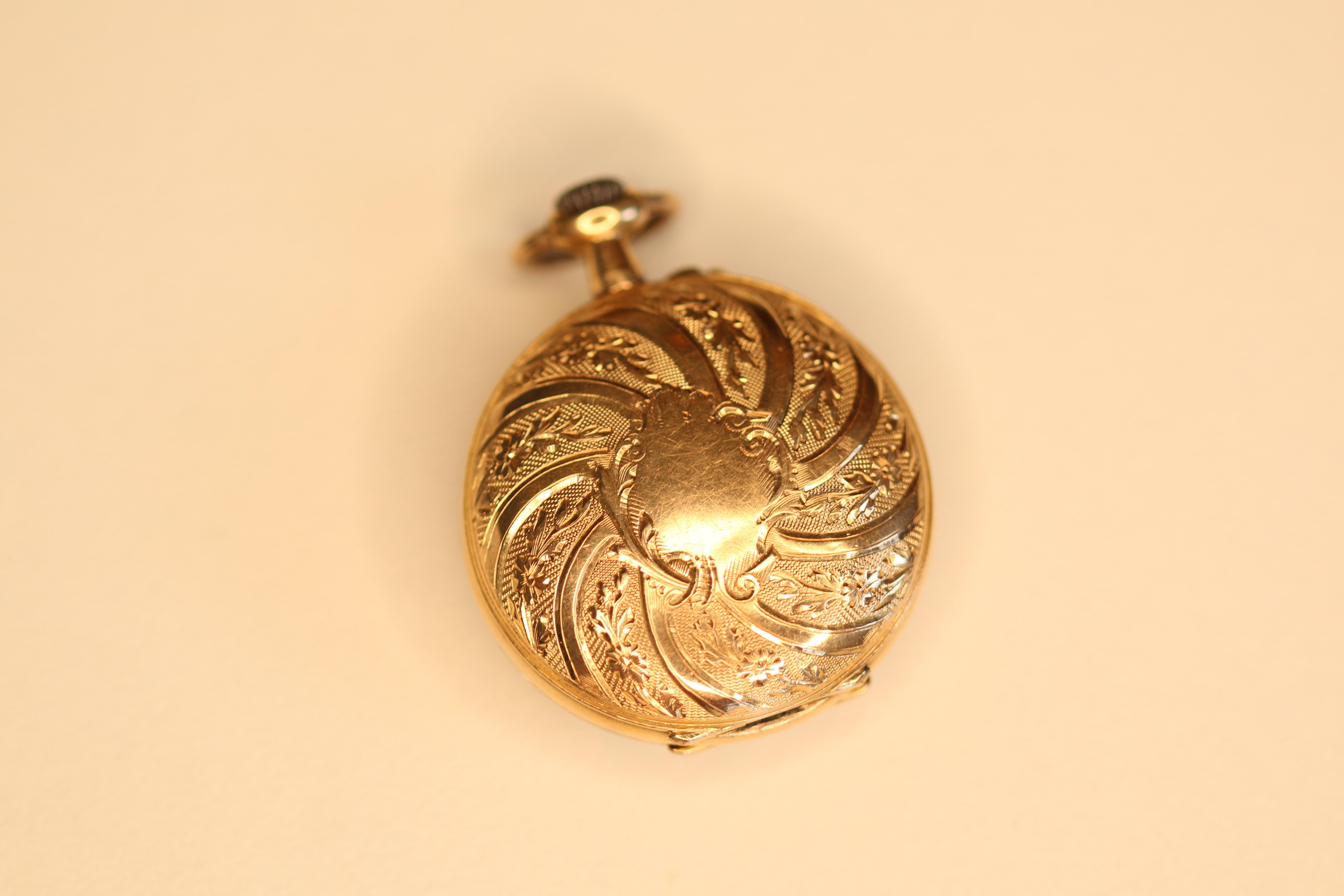 Victorian solid 14 kt gold ladies pocket watch . this watch has a 15 jewel mechanical hand winding movement that is in good working condition. This watch has a beautiful porcelain dial. All covers are stamped 14k the dust cover is engraved with