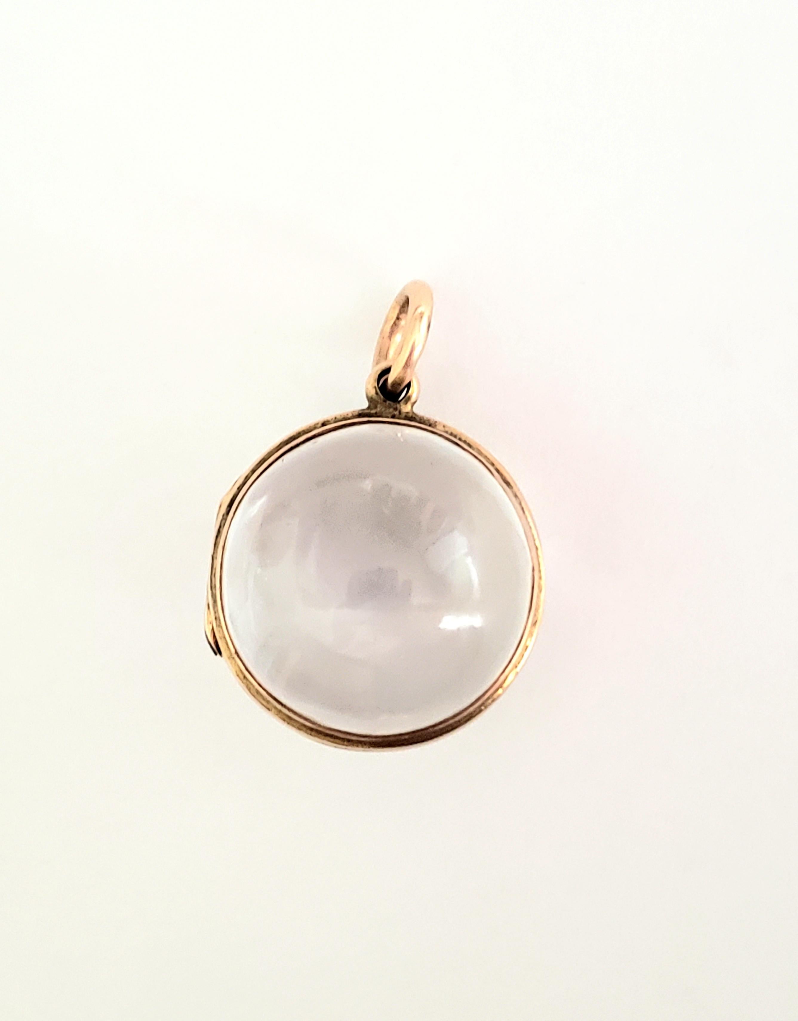 An antique Victorian hand carved Rock Crystal locket pendant in gold mount. 

Width including mount 20mm.
Total drop 27mm.
Weight 10.9gr.
Unmarked, tested positive for gold. 

The locket in good working order, the Rock Crystal with a small chip