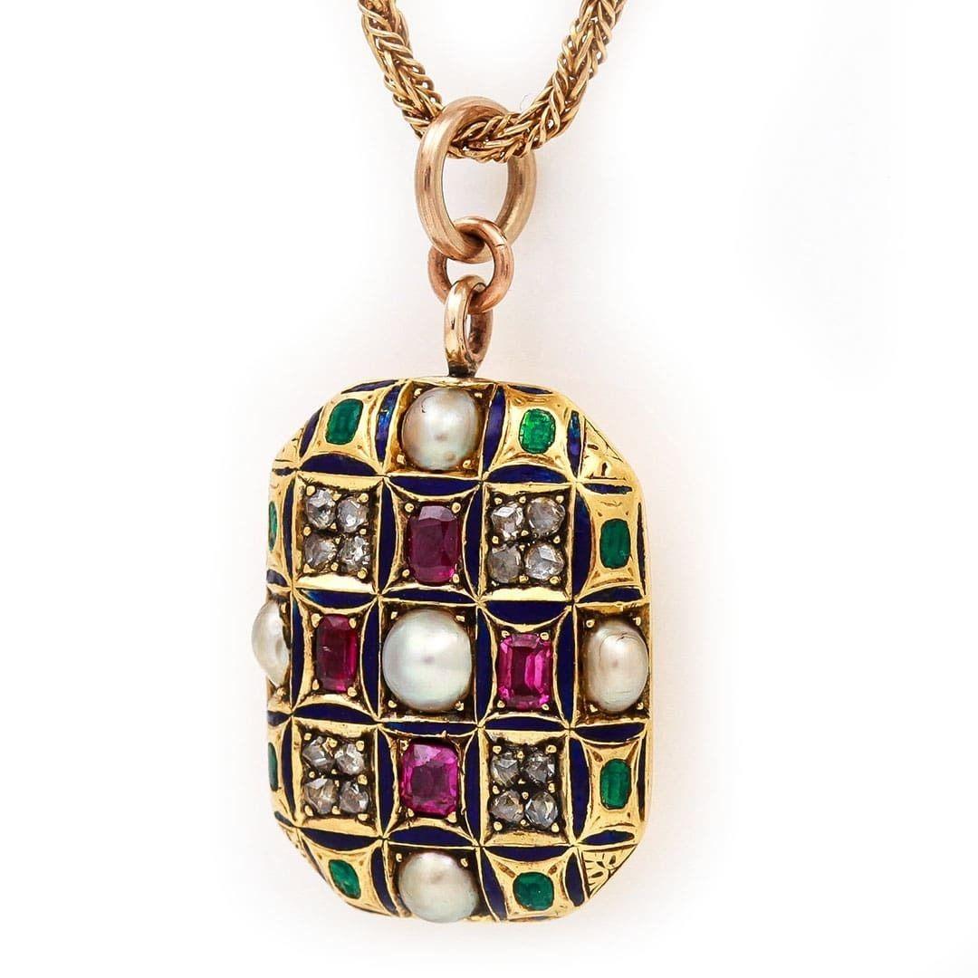 A wonderful and unusual Victorian 9ct yellow gold rose cut diamond, ruby, split pearl and multi hue enamel locket dating from circa 1870. A Holbeinesque style piece with its use of gemstones and enamel very much in the manner of Holbein (in