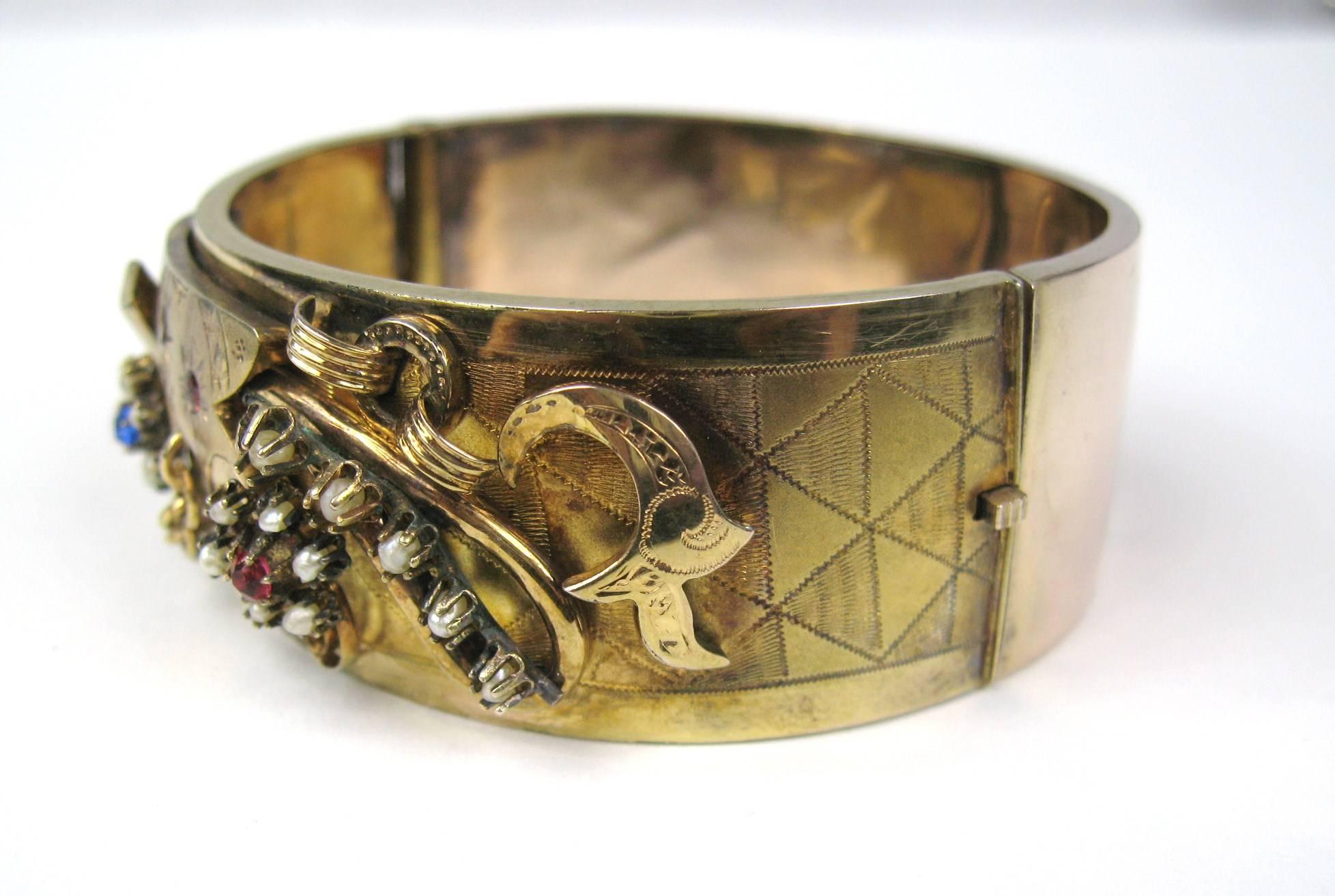 You don't see this workmanship anymore, simply stunning! Wide Victorian bangle 14K gold Bracelet with Seed Pearls with Blue and Red stone accents Measures approximately 1.00 wide. This is out of a massive collection of Costume Jewelry, Hopi, Zuni,