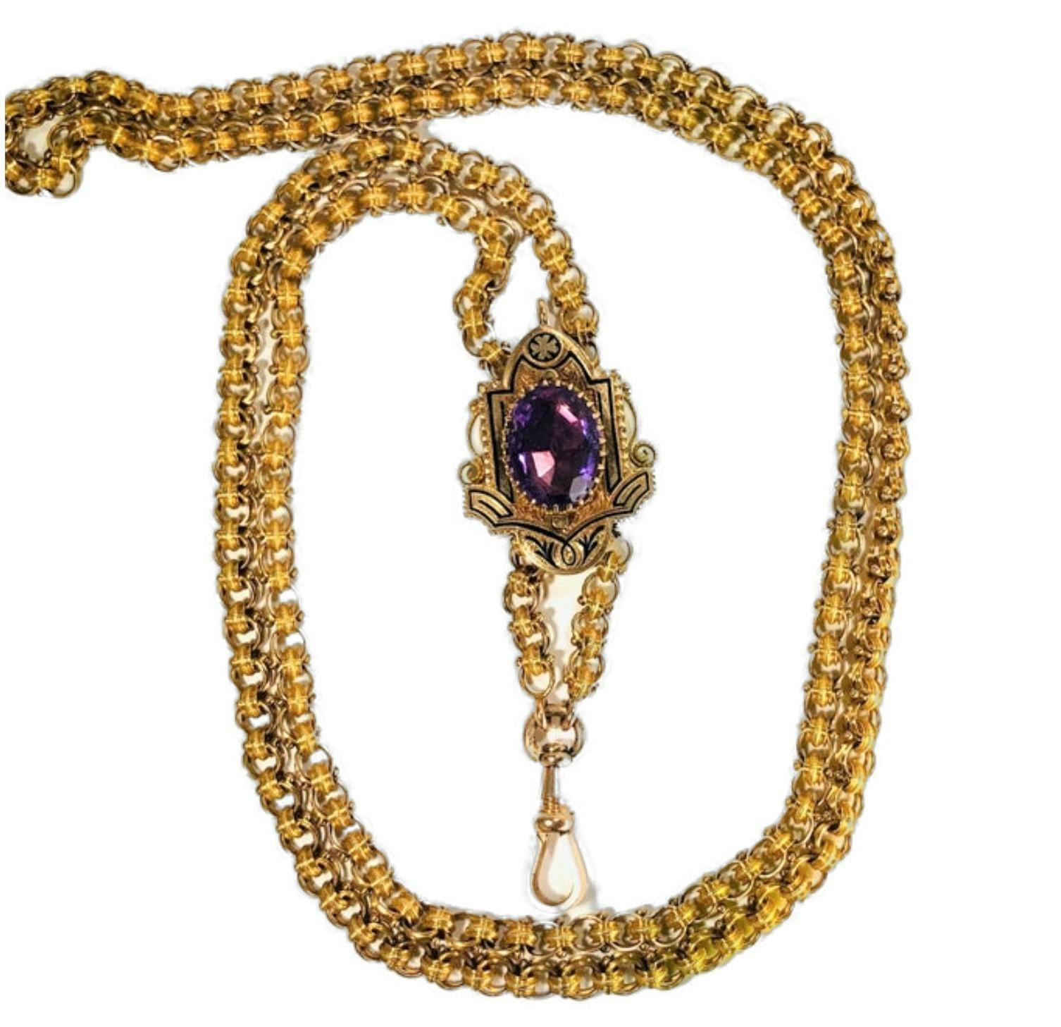 This wonderful, authentic, Victorian 14K Yellow Gold slide necklace is a full 60 inches long, and features a slide set with one large oval cut Amethyst, framed by engraved gold and black enamel. Each individual link is beaded and the necklace has,