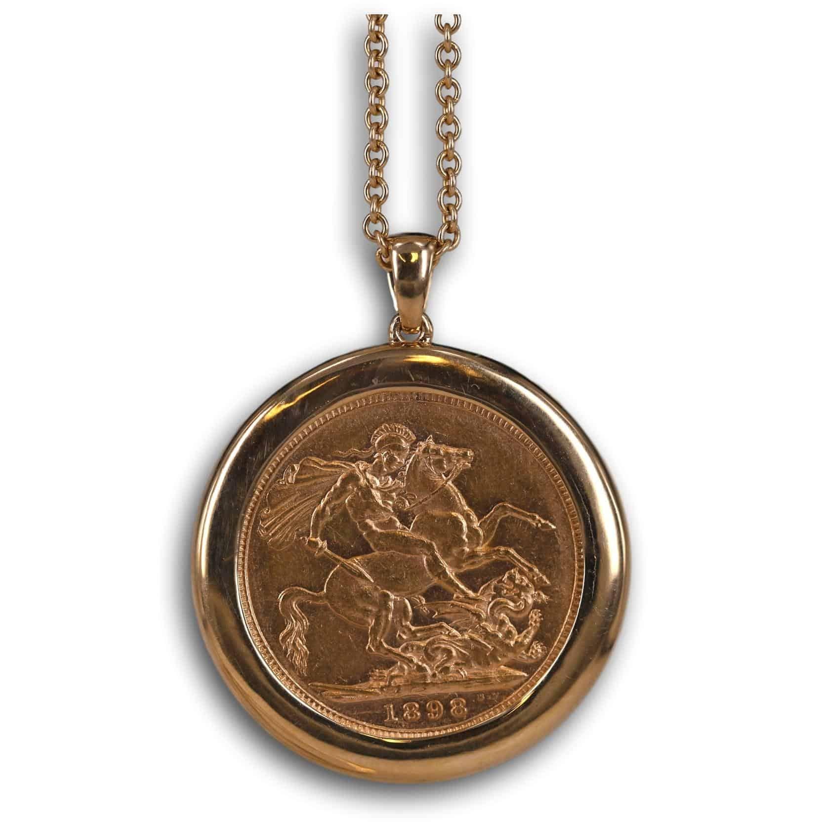 This 18k gold antique sovereign pendant and chain showcases a part of history encased in an elegant design. As the 22k gold sovereign coin is encircled in a halo of gold,  your attention is drawn to it instantly. Likewise, as it hangs from a