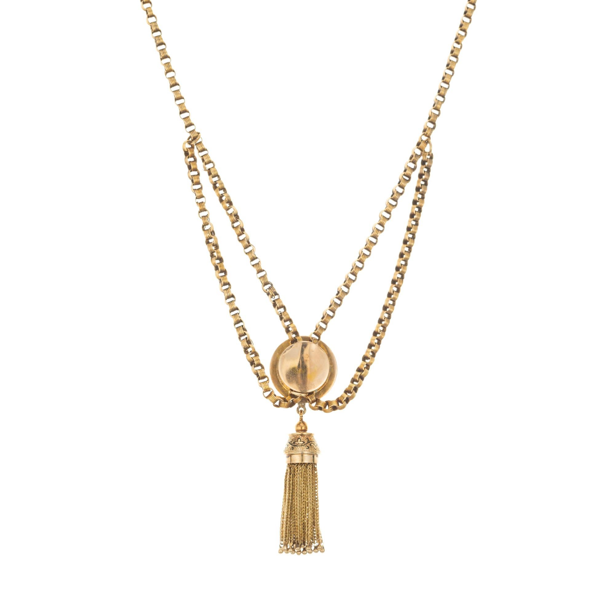 1860's Victorian gold tassel engraved pendant necklace. Crafted with meticulous attention to detail, this pendant features intricate engravings, reminiscent of the ornate designs from the Victorian era, creating a captivating and sophisticated look.