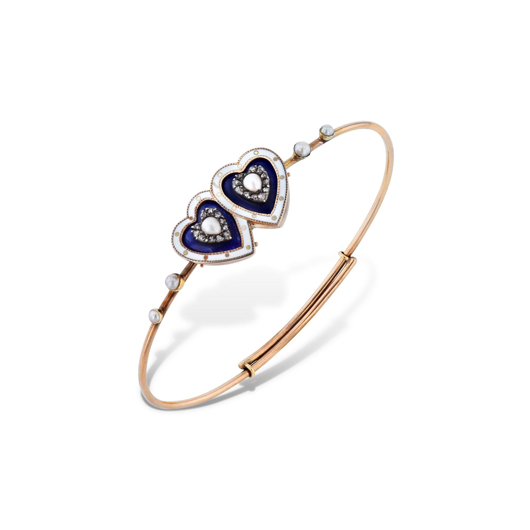 A magnificent combination of 14kt gold, 22 stunning rose cut diamonds, delicate blue and white enamel embellishments, and 6 alluring natural seed pearls make the Victorian Gold Twin Hearts Diamond Estate Bracelet a stunning addition to any jewelry