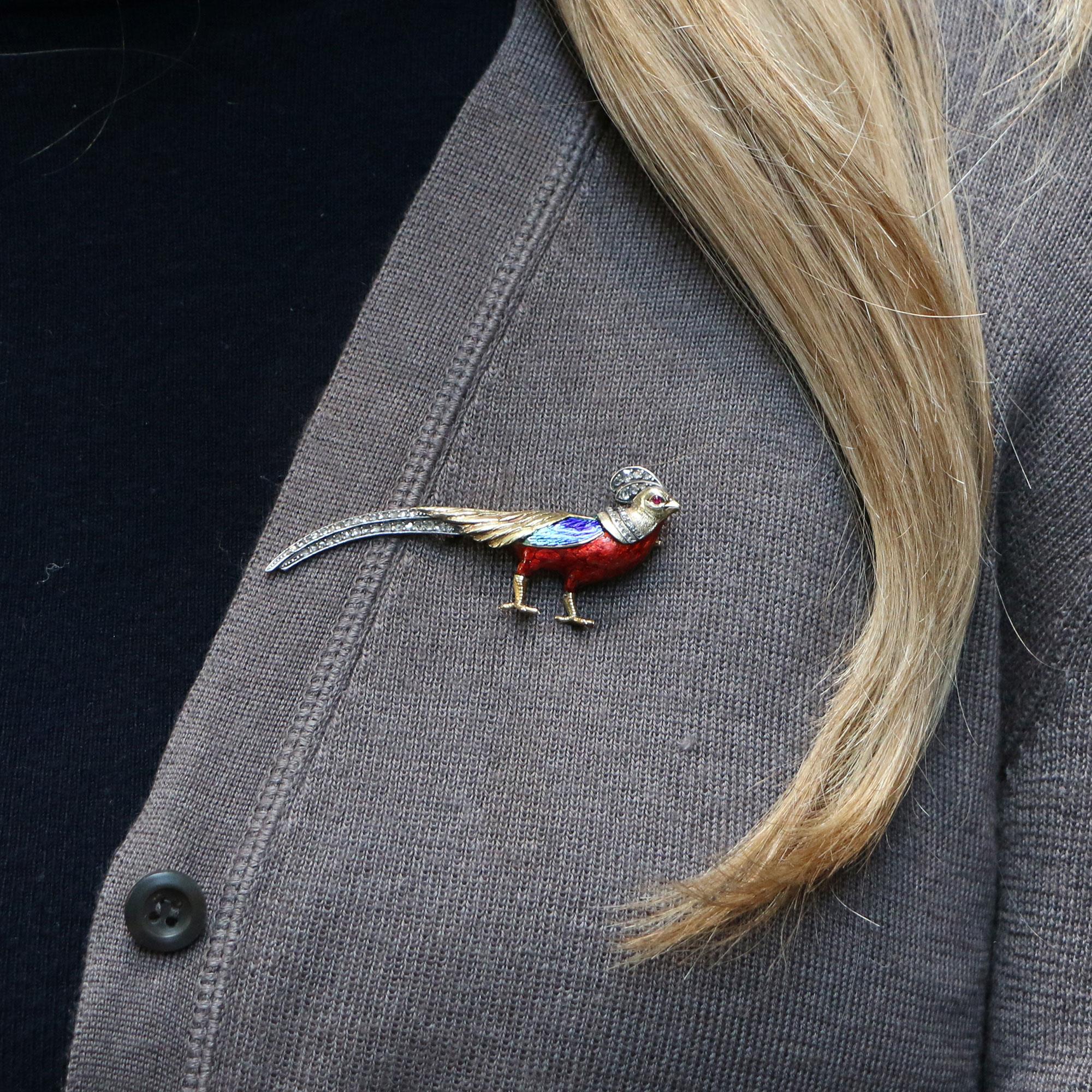 A beautiful Victorian diamond and enamel pheasant brooch set in silver-on-gold. 

The brooch depicts a standing pheasant, hand detailed to have a naturalistic look. The bird's head, wings and feet are in carved yellow gold with the rest of the body