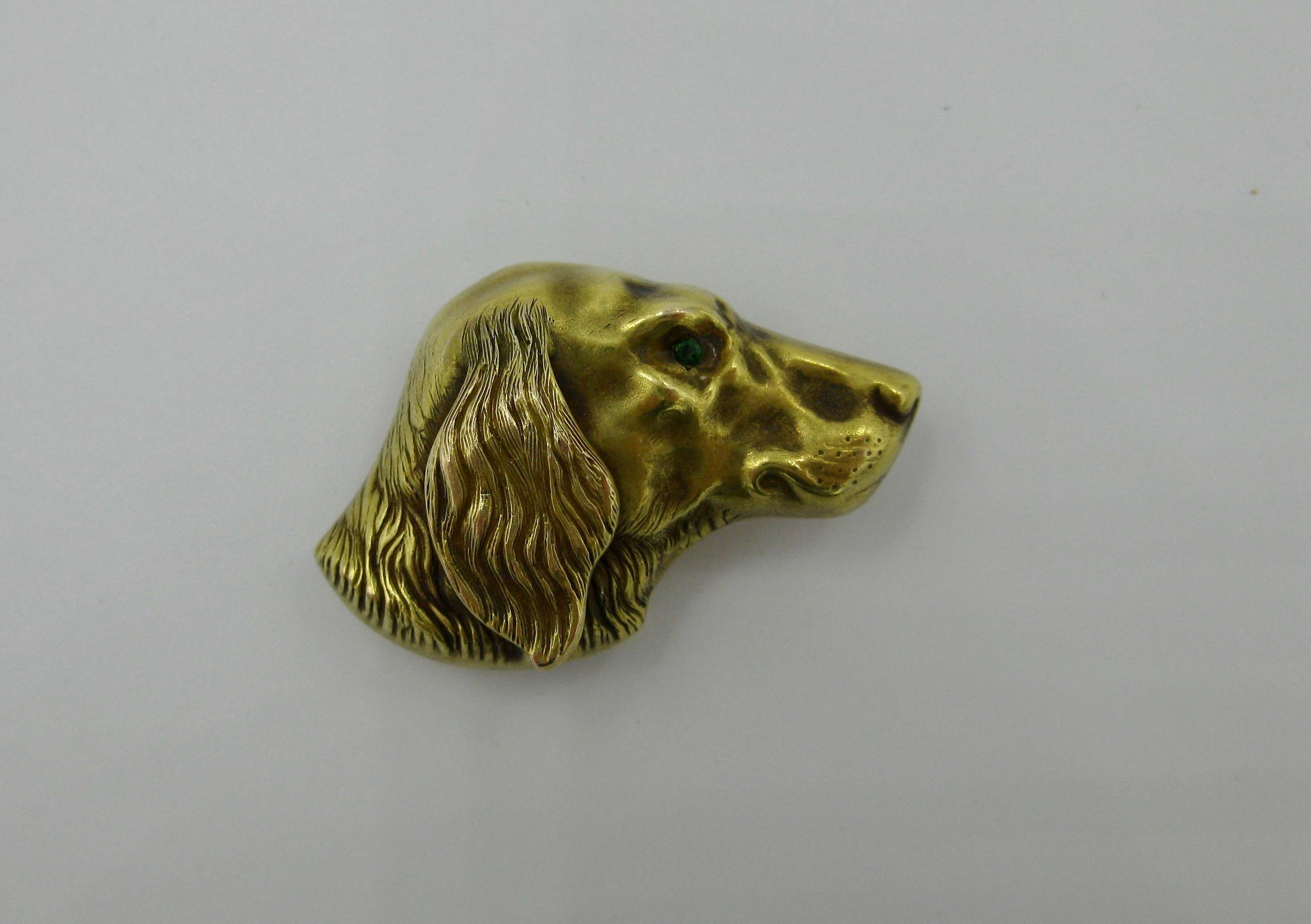 A very special Golden Retriever Dog Brooch Watch Pin in 14 Karat Gold with an Emerald eye.  Dating to the Victorian period and made by the esteemed Riker Bros.  It is so very rare to find antique jewelry depicting Golden Retriever dogs! The design