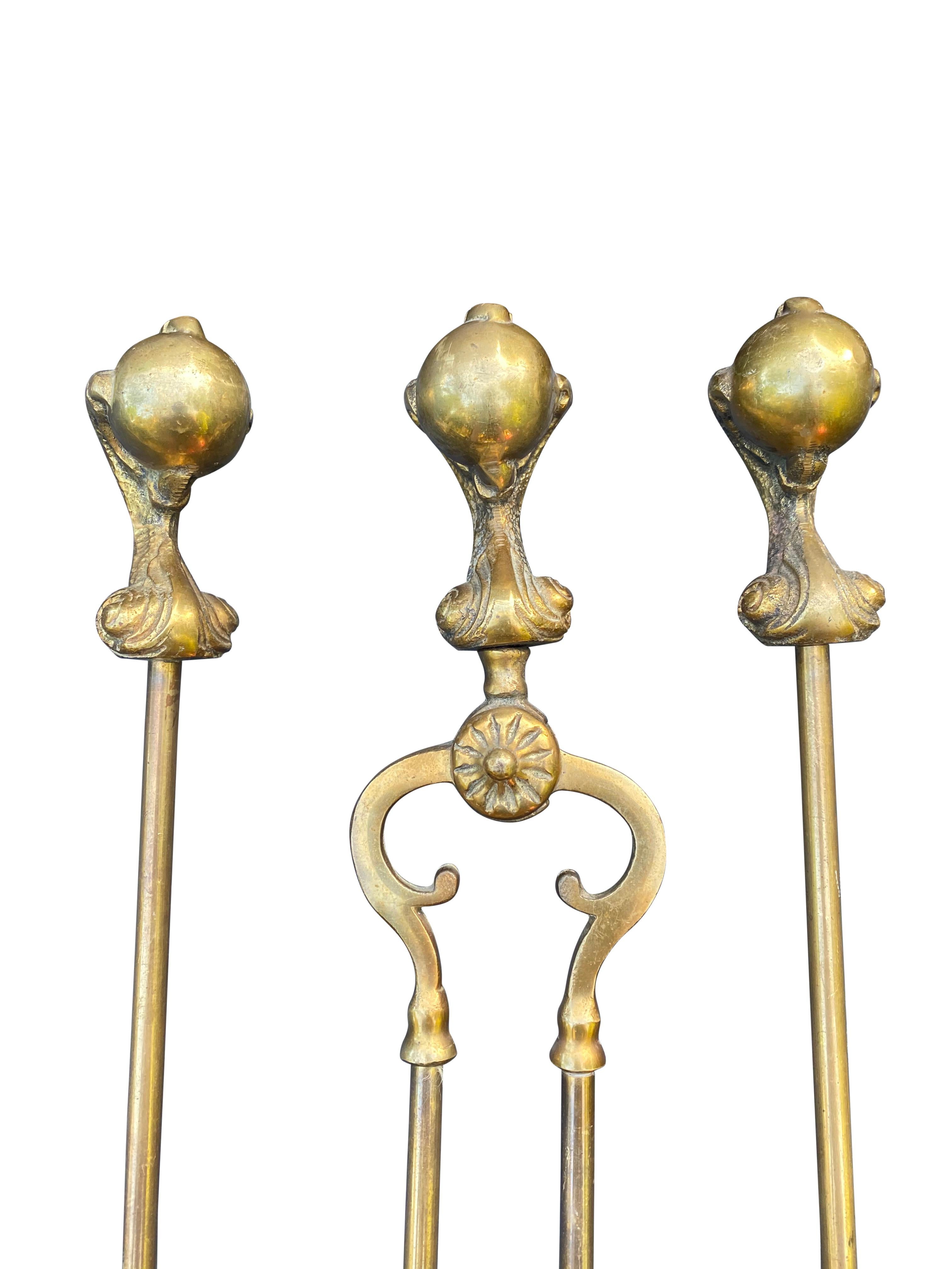 English Victorian Gothic Brass Ball and Eagle Claw Motif Fire Companion Set For Sale