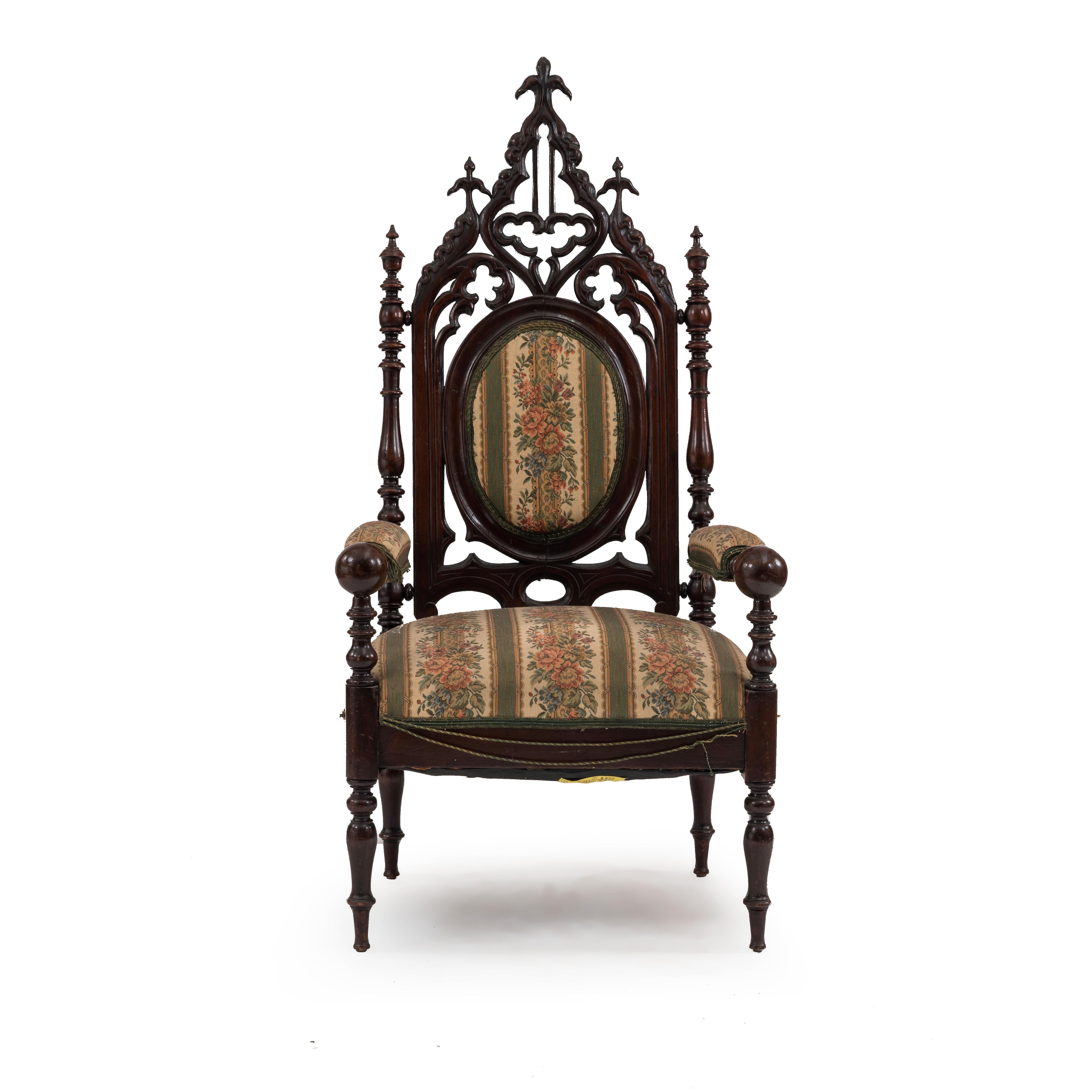 American Victorian Gothic Revival mahogany arm chair with ogee arched back & green striped seat. (late 19th Cent)
