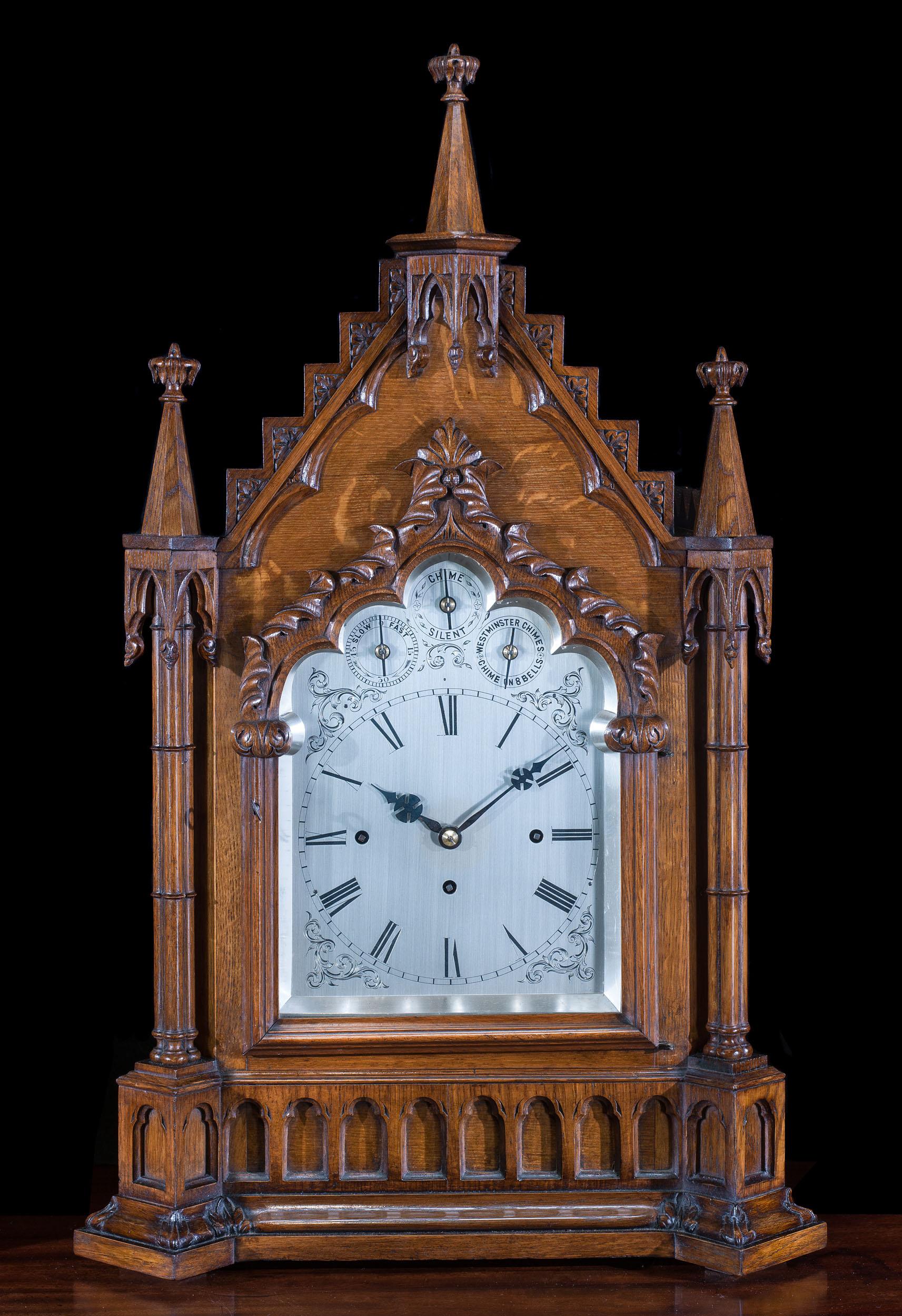 A fine and large nineteenth-century Gothic Revival oak bracket clock, with a silvered dial.

The clock has an eight day, triple fusee, four pillar movement with anchor escapement and chimes the quarters on either eight or four bells, 
