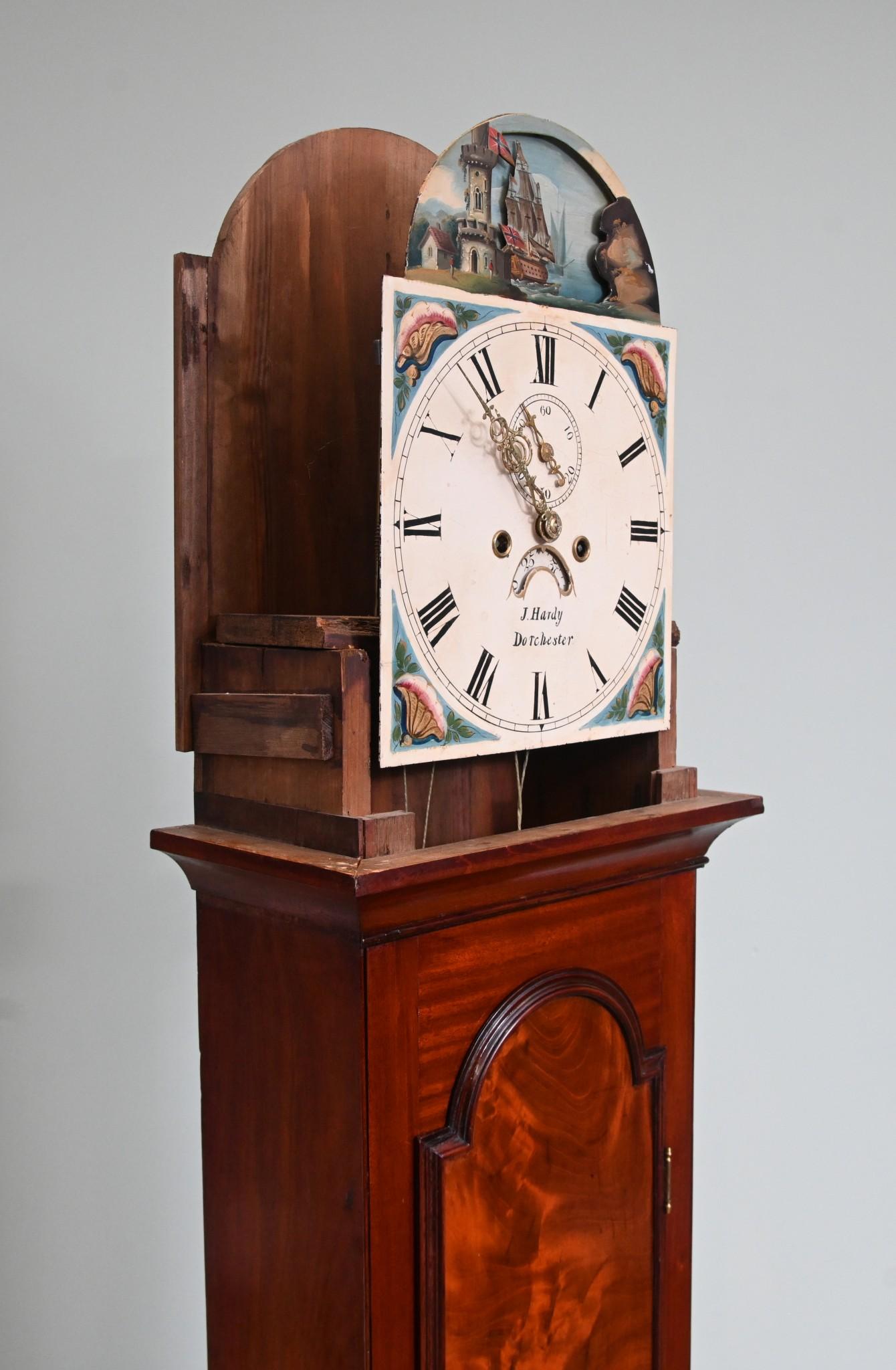 Gorgeous Victorian grandfather clock by J Hardy of Dorchester
Clean and functional clock with three brass balls to the top and surmounted by an eagle
Clock face has words of maker J Hardy of Dorchester (in Dorset)
Also features hand painted designs