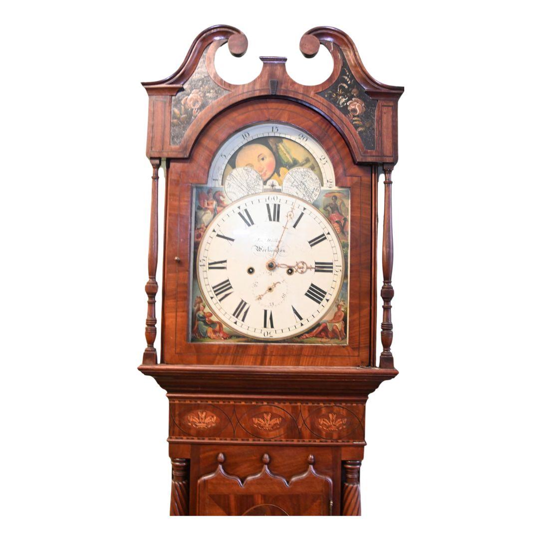 Elegant Victorian grand father clock in mahogany
Features a revolving moon dial
Also has a gothic style door
Inlaid oval mahogany panel
Decorative columns either side of the case and bottom
Standing oggee cabriole legs
Josh Walker was a famous clock