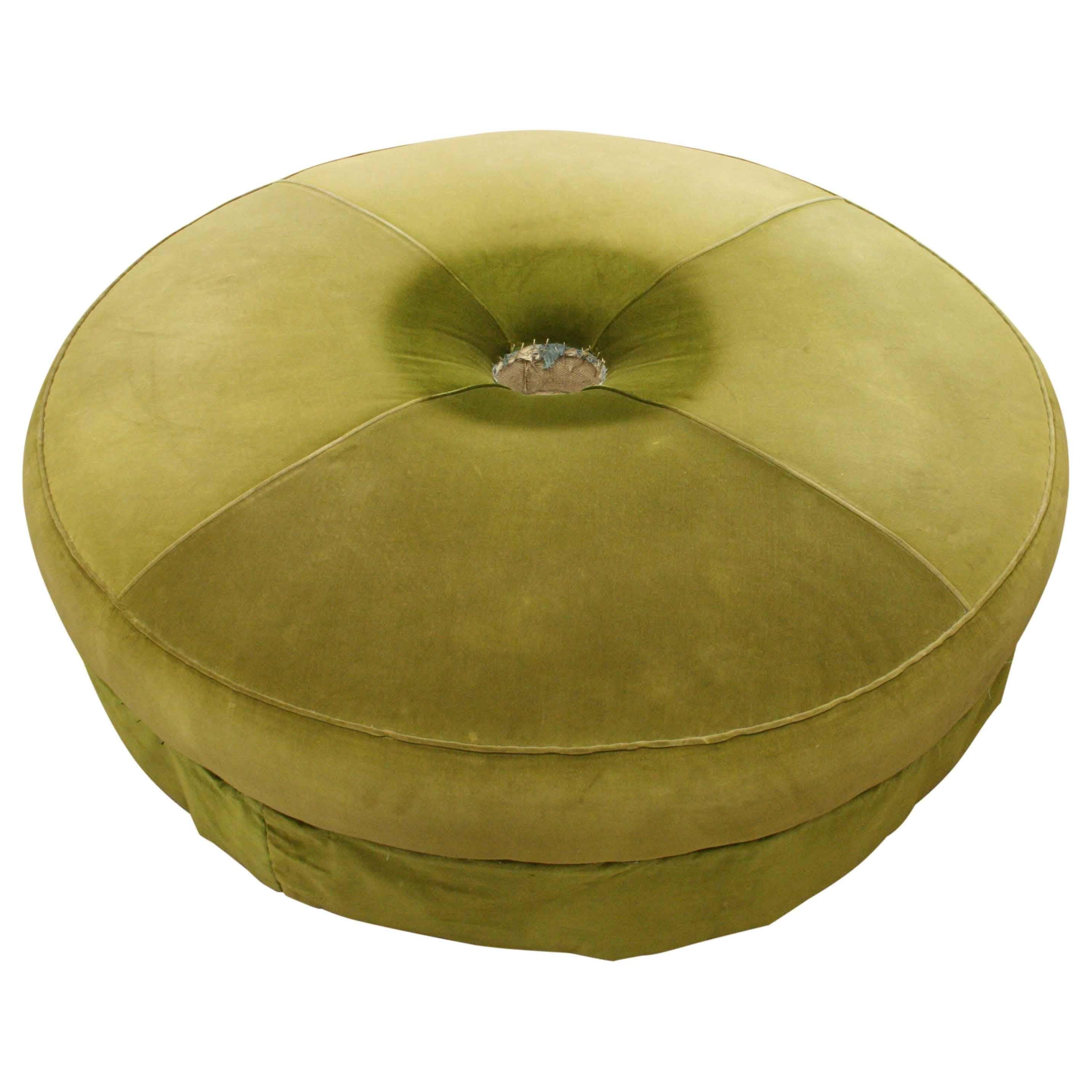 Large Victorian circular conversation sofa, upholstered in green velvet with nice piping, circa 1870. There is a padded centre section in the form of a dome. The whole piece stands on four large bulbous tapering feet, finishing on brass cup castors.