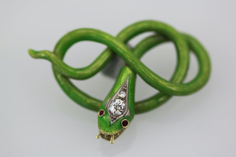 This gorgeous enamel snake pendant is unusual in color and the fact that this is not a brooch but a pendant.  There are 2 hooks to place a chain that are slightly hidden. You can always add a pin to make this a brooch but I just love it on a chain. 