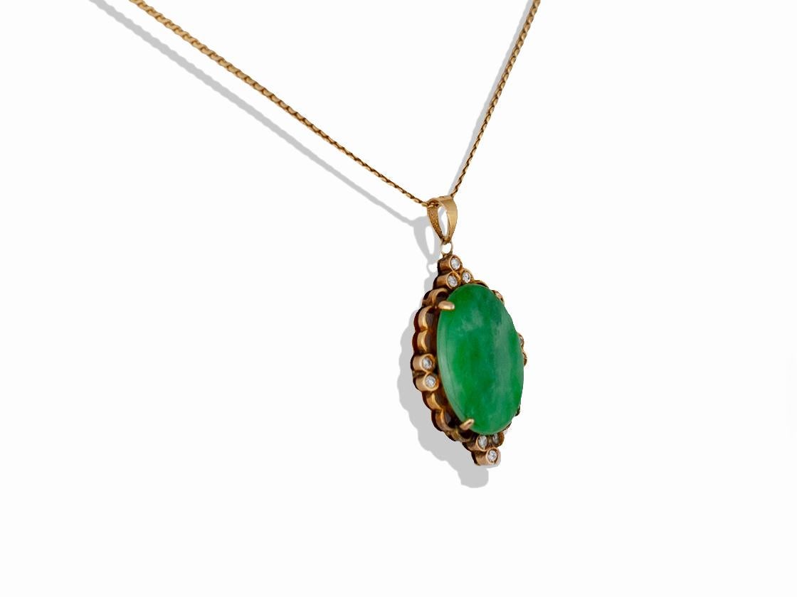 Victorian jade and diamond pendant. The center oval cabochon piece of jade measures 19.5 x 13.5 x 4mm. The jade is set in 18k yellow gold and has 10 round brilliant diamonds that measure 1.7-1.9 mm and have a color and clarity of G-H VS- SI. This