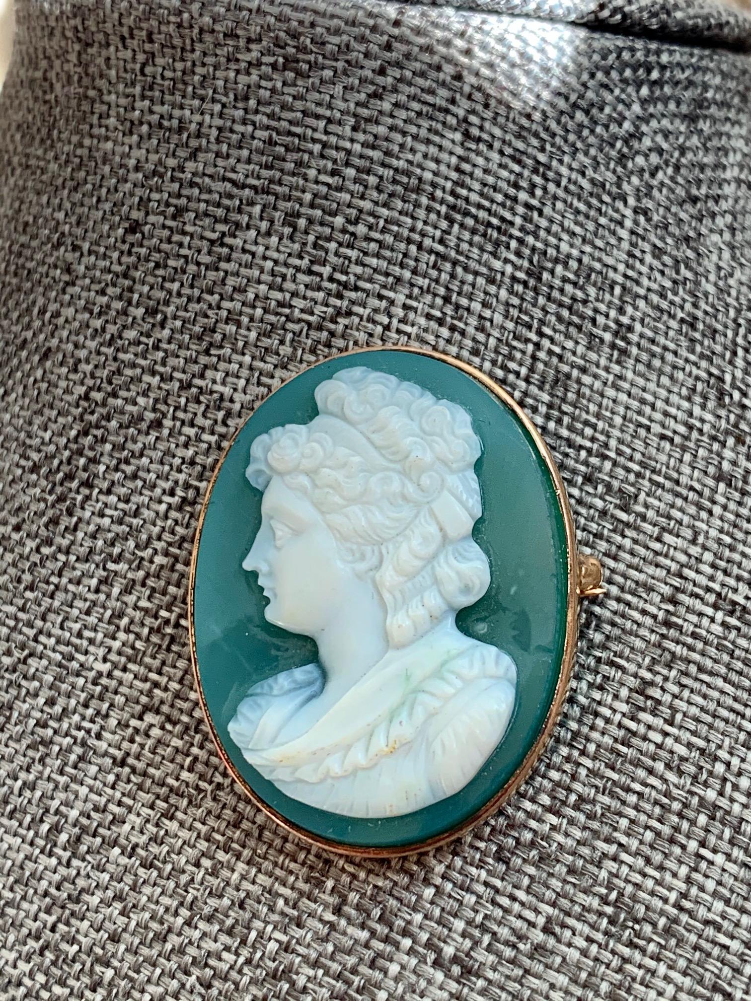 This cameo is so lovely and one which is rarely seen in Green Onyx. It's sure to be a conversation piece.   The setting is 14 karat yellow Gold.

Size: 35 x 27mm
Weight:  9.8 Grams

This piece is in beautiful condition. 