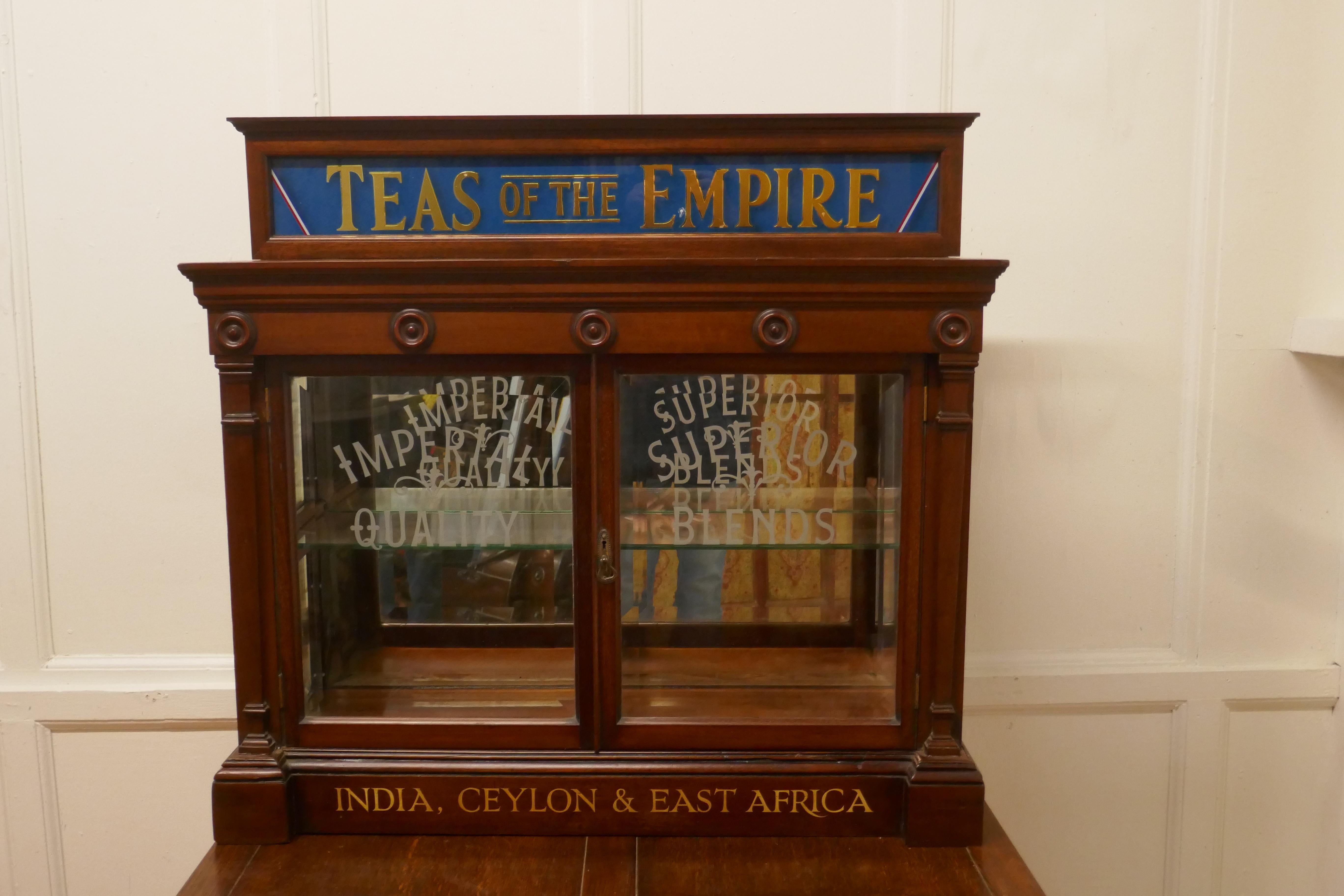 Victorian Grocers tea cupboard, tea room, cafe display

A magnificent piece of social history a Victorian Grocers shop cupboard, with a blue mirror cornice and Gold Leaf writing advertising Teas of the Empire
The cupboard can be either wall hung