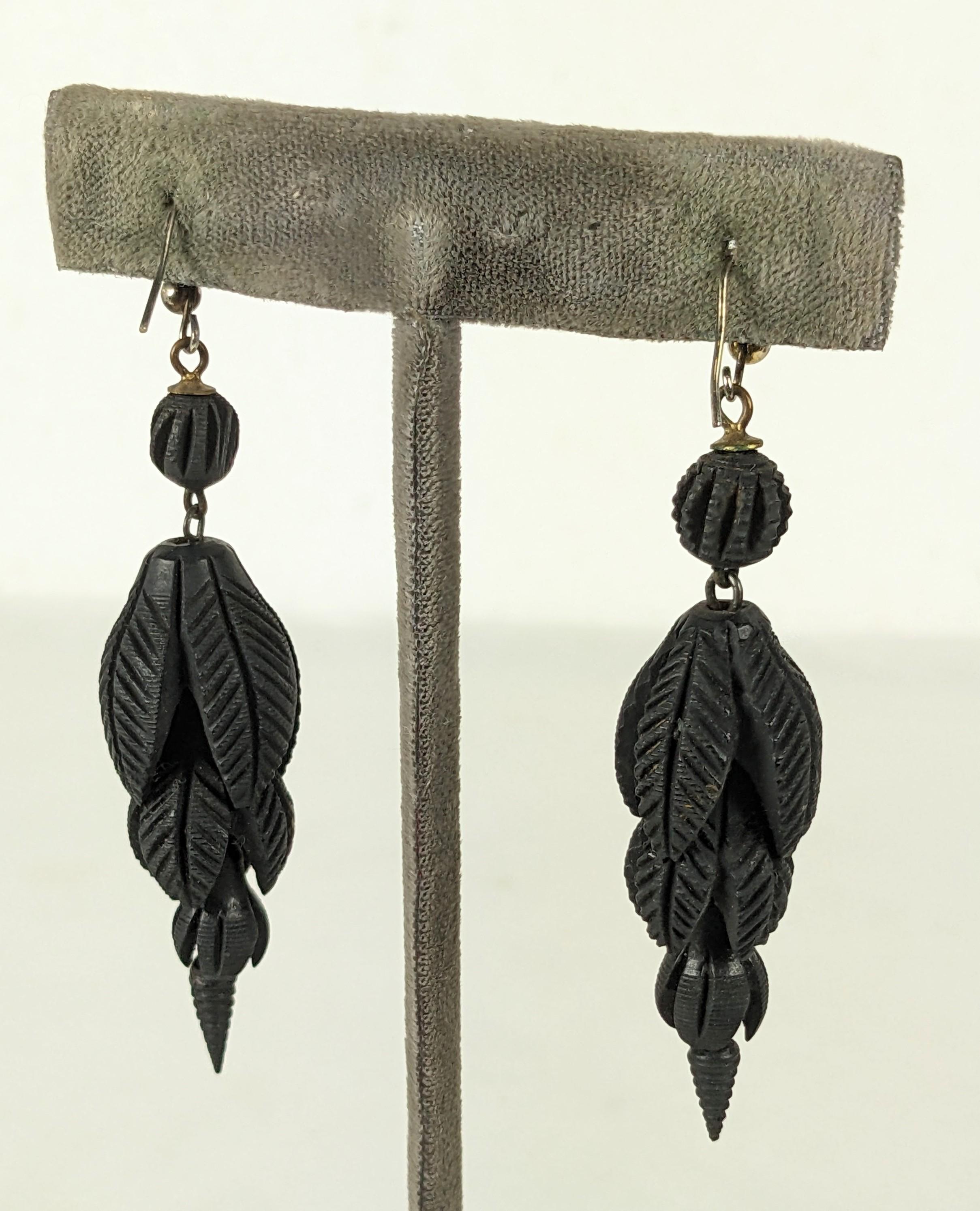 Lovely Victorian Gutta Percha Carved Graduated Pod Earrings circa 1870's. Articulated floriform caps are carved from larger to smaller with a carved ball at ear. 
Original wires. 2.5