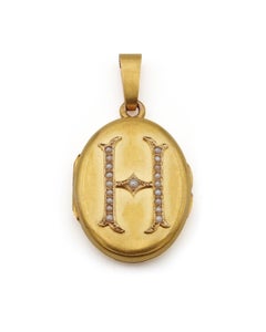 Victorian H letter locket pendant in 18 karat gold