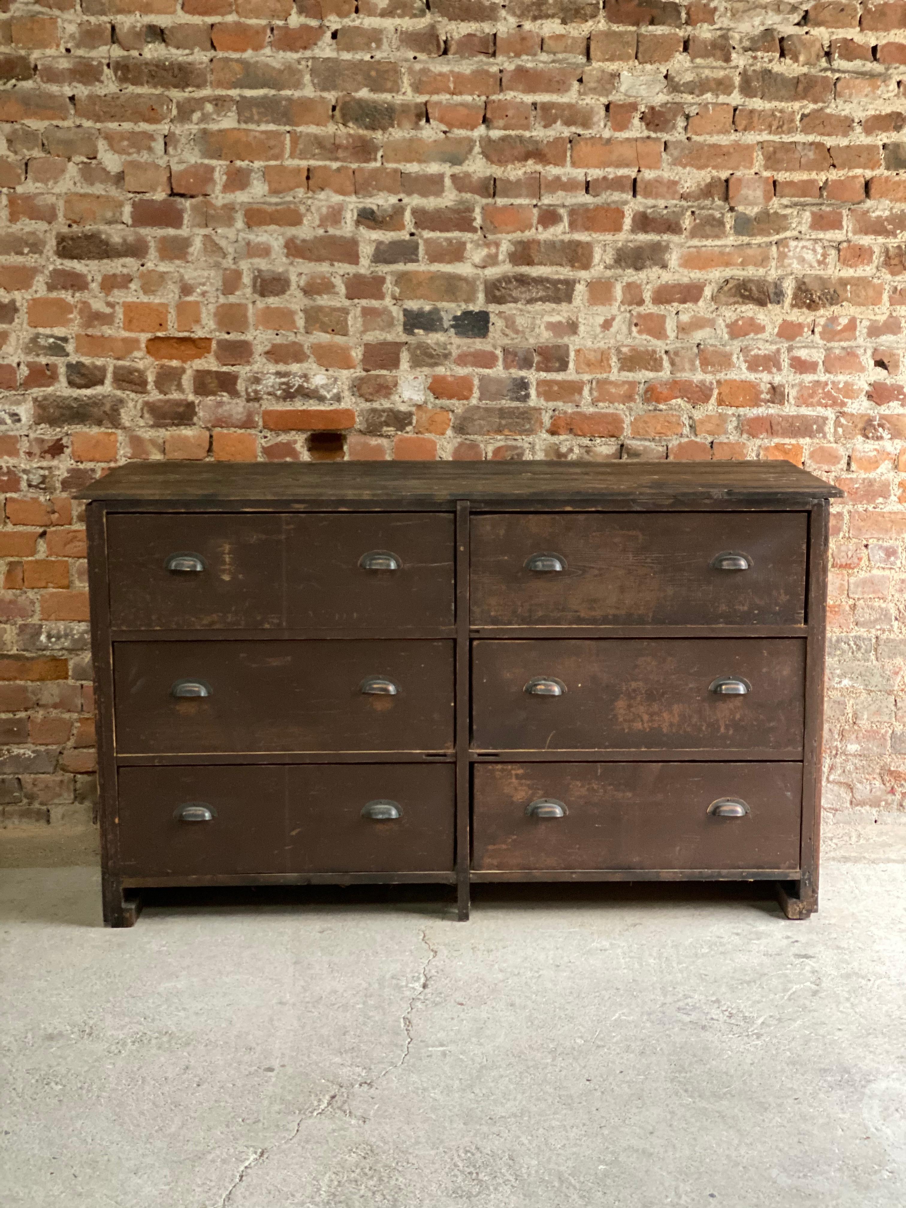 Large industrial haberdashery pine bank of drawers circa 1890, the rectangular tongue and groove top over six large pullout drawers with original copper cup handles, original rustic appearance with great patina, perfect for that loft space or
