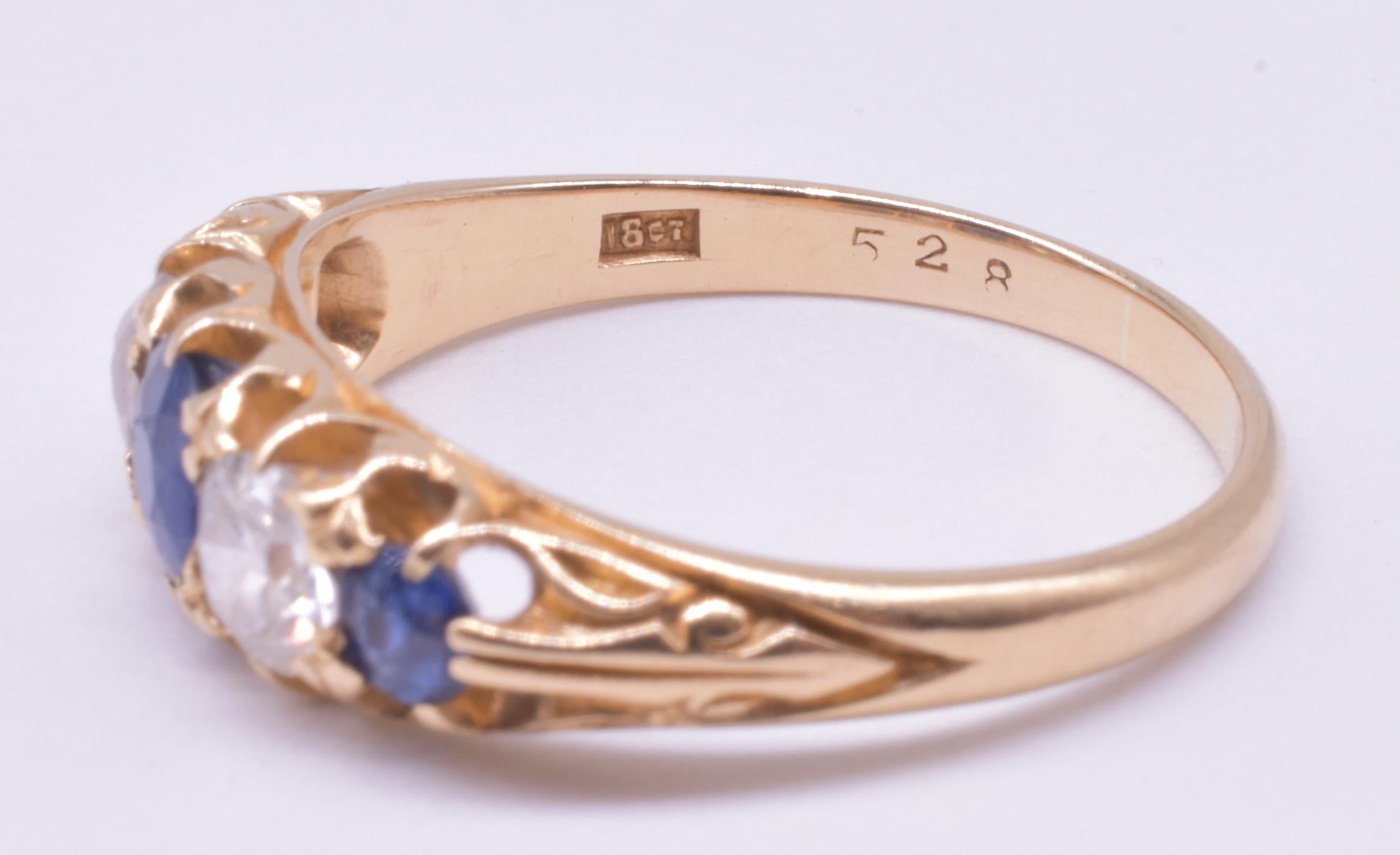 18K yellow gold sapphire ring with three Old Mine cut sapphires and two diamonds, all roughly equal in size, in the form of the half hoop ring, with the emphasis on the gemstones. The ring is set 