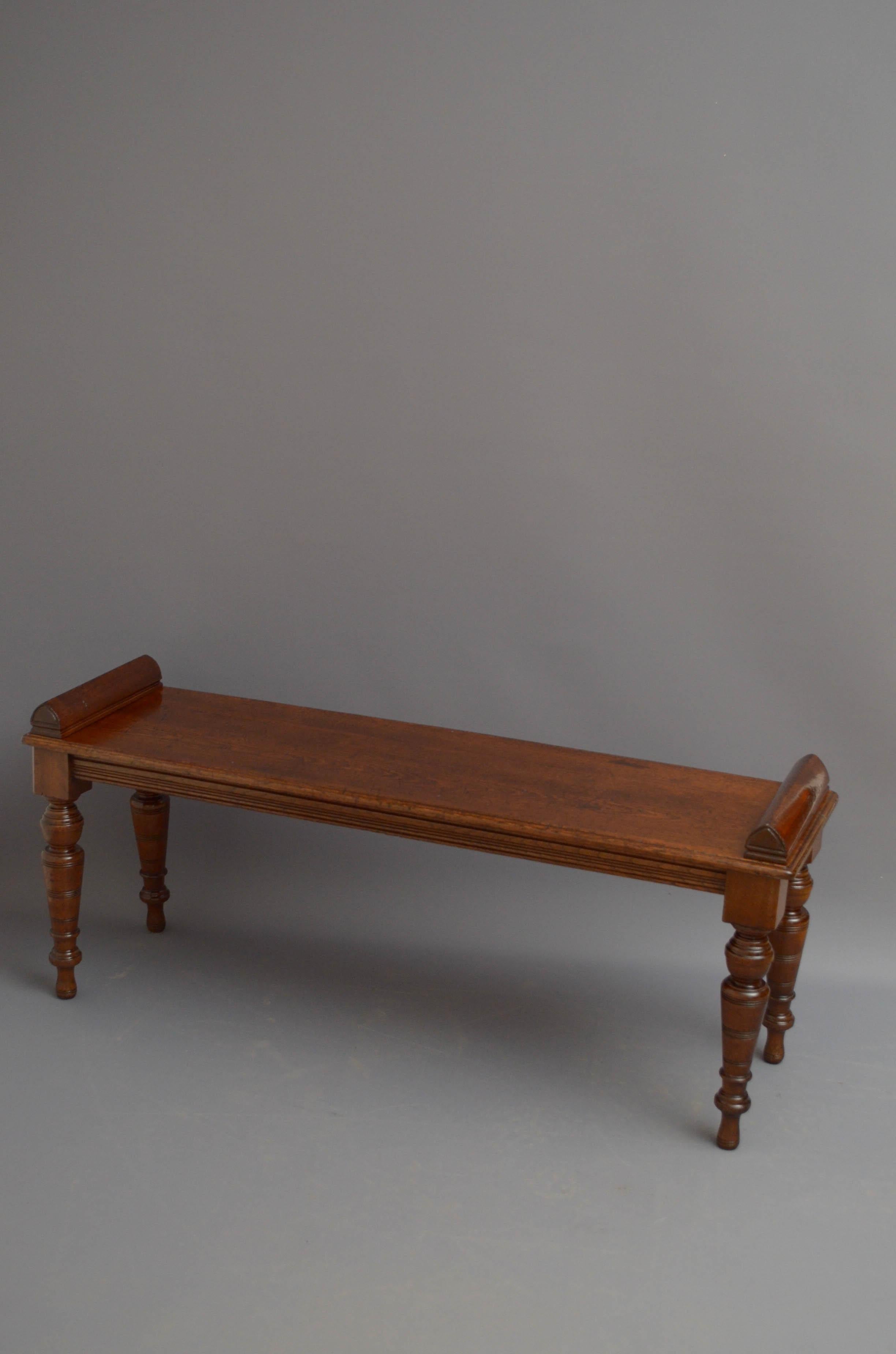 St04 Victorian oak hall bench, having oblong seat with carved ends and moulded edge above a reeded frieze all standing on turned, tapered and ringed legs. This antique bench has been syamthetically restored and is ready to place at home.
