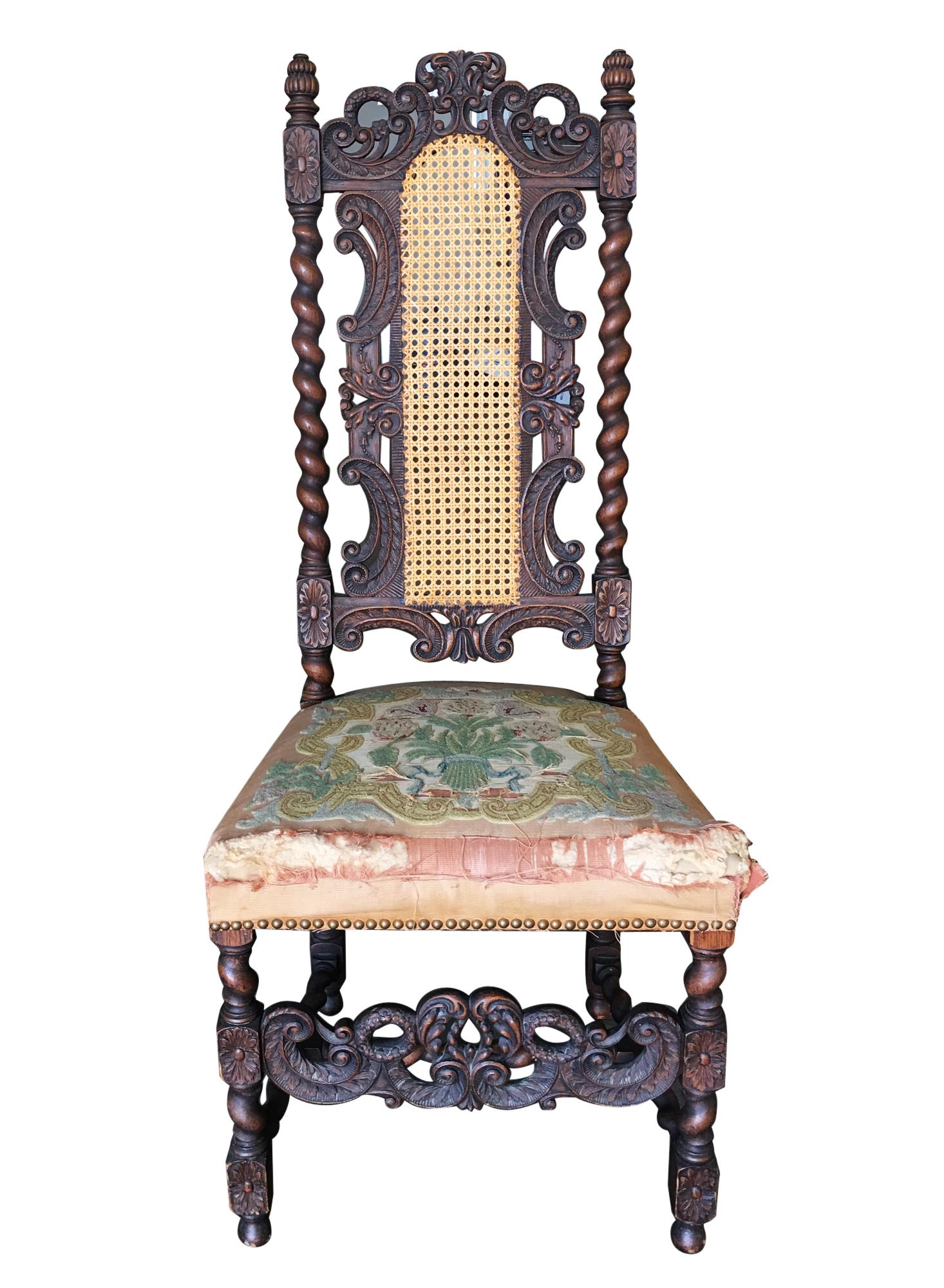 Victorian hand carved oak Gothic revival side throne chair with woven cane wicker back and needle point seat,

circa 1860.