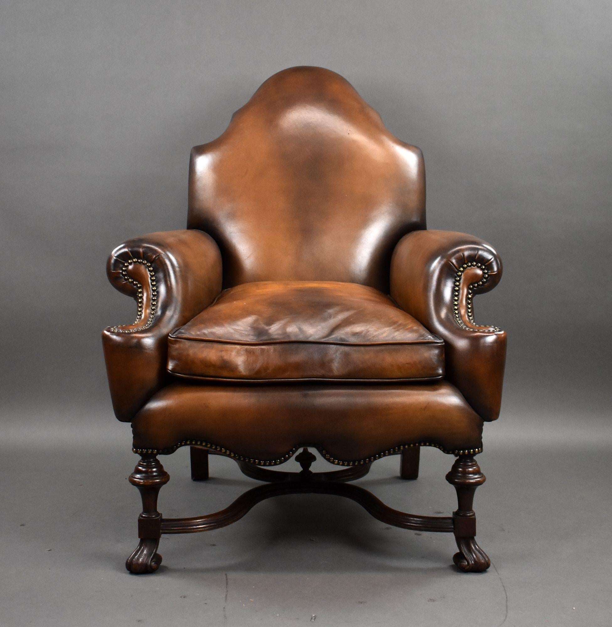 For sale is a fine quality Victorian Walnut Framed Leather Armchair. With a nicely shaped back and arms, the chair stands on carved feet united by a shaped stretcher with a finial to the centre. The chair is in excellent condition having been