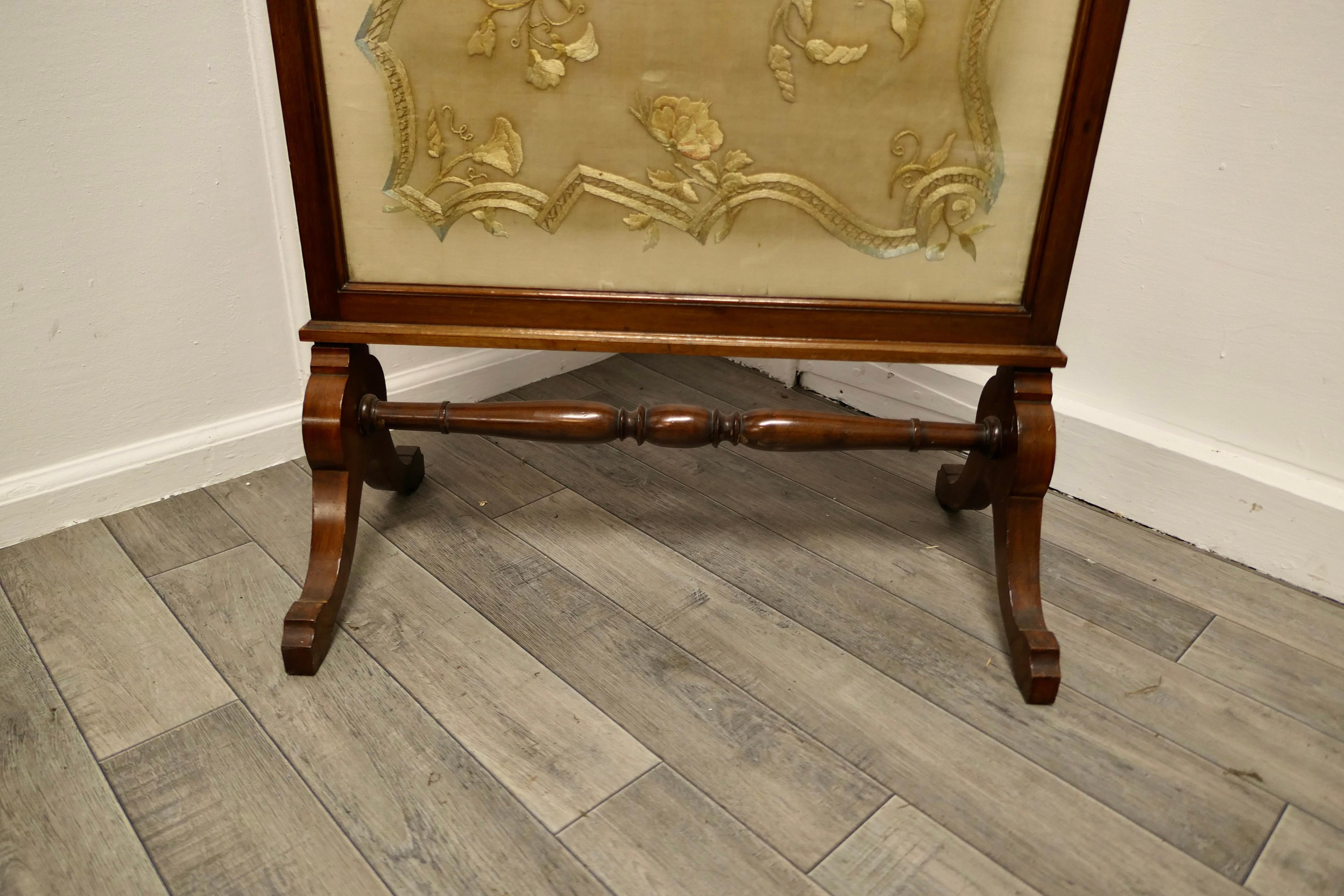 Victorian Hand embroidered silk and mahogany fire screen

This is a fine-looking piece, it is a large screen 
The silk inset has been protected with glass so it is in original condition with a little fading due to the light
The Regency style