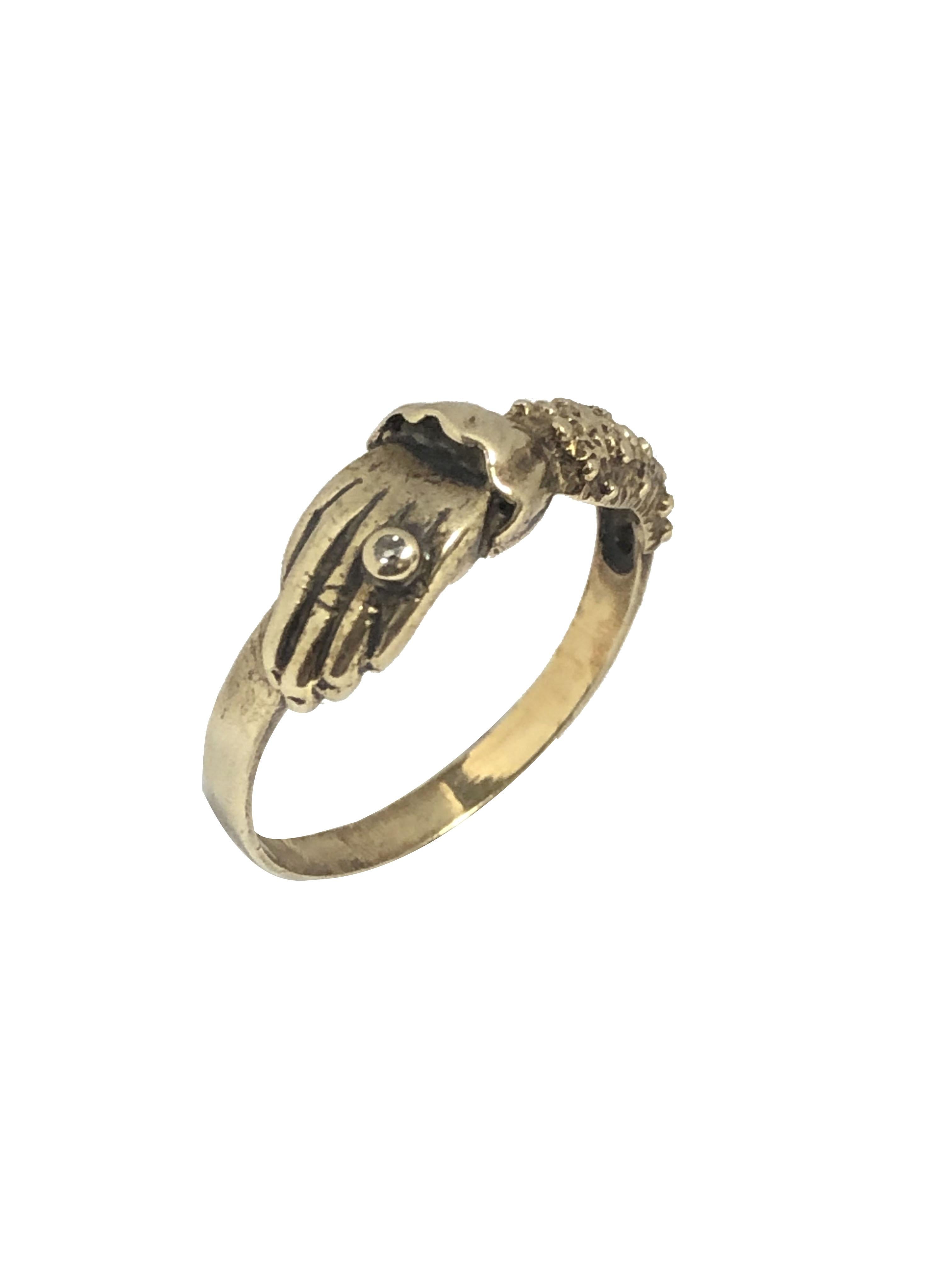 Circa 1880 - 1890 9K Yellow Gold English Hallmarked Hand Over heart Ring, the top measures 5/8 X 1/4 inch, very nicely detailed and having a diamond set ring on one of the fingers. Finger size 8. 