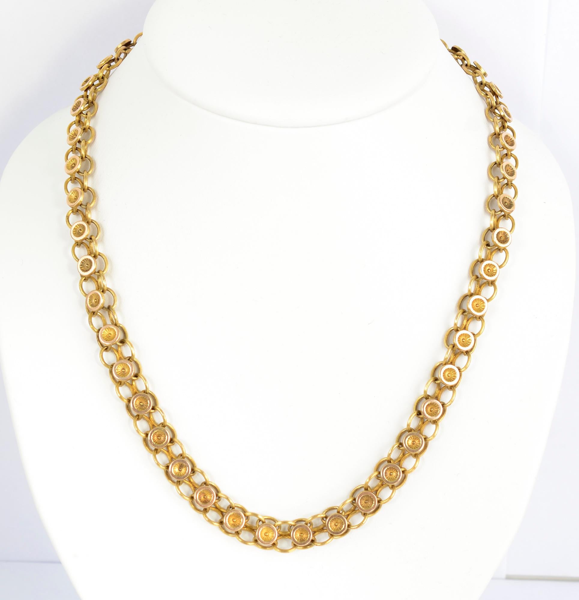 Handmade Victorian chain necklace of 14 karat gold. Round medallions sit upon a double row of oval links. The necklace is 20 inches long. It can be worn on its own or with a pendant suspended.